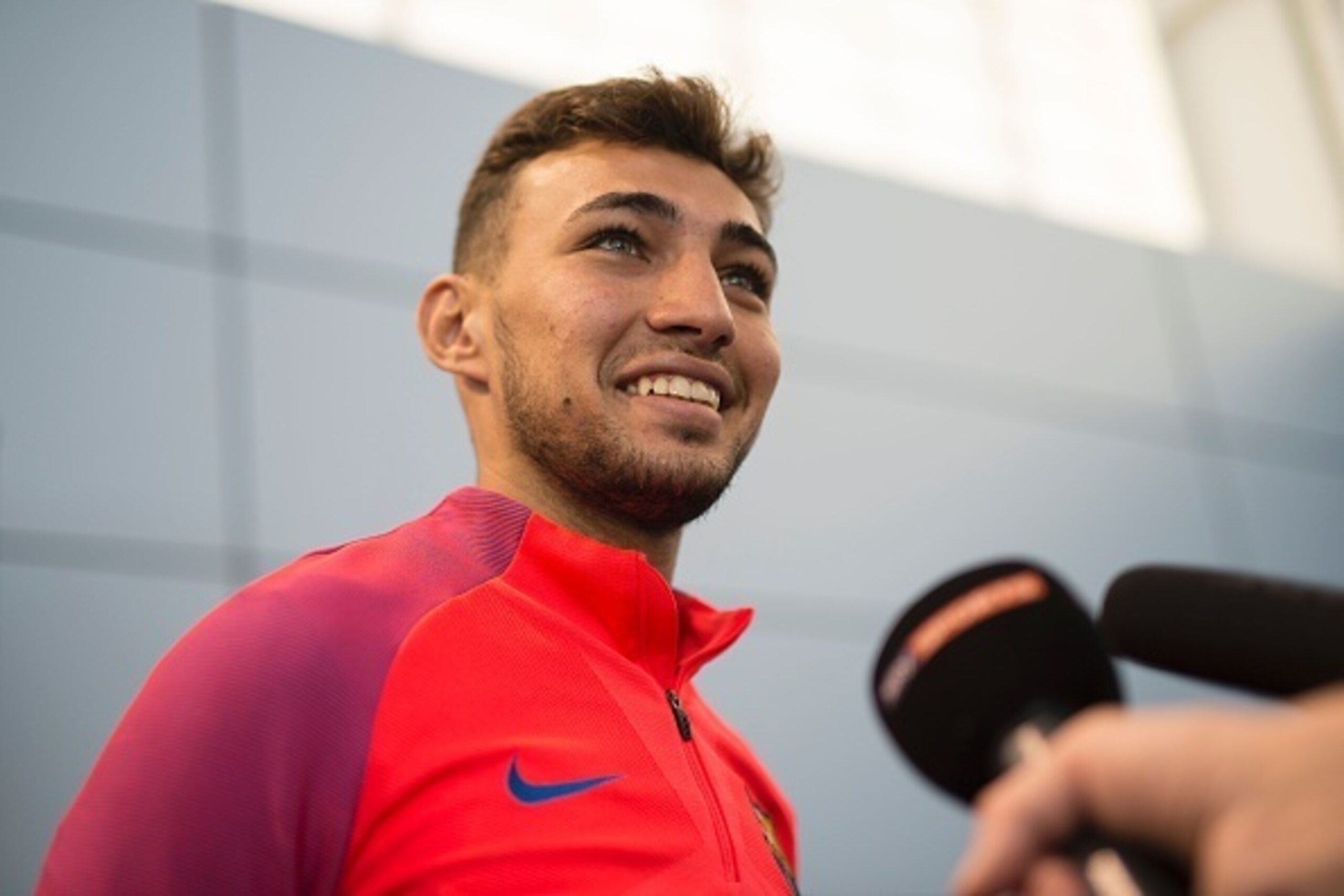 Barcelona's Spanish forward Munir El Haddadi relaxes speaks during an interview following a team training session at St George's Park near Burton-on-Trent, central England, on July 26, 2016.
Barcelona are taking part in a five-day training camp at the Eng