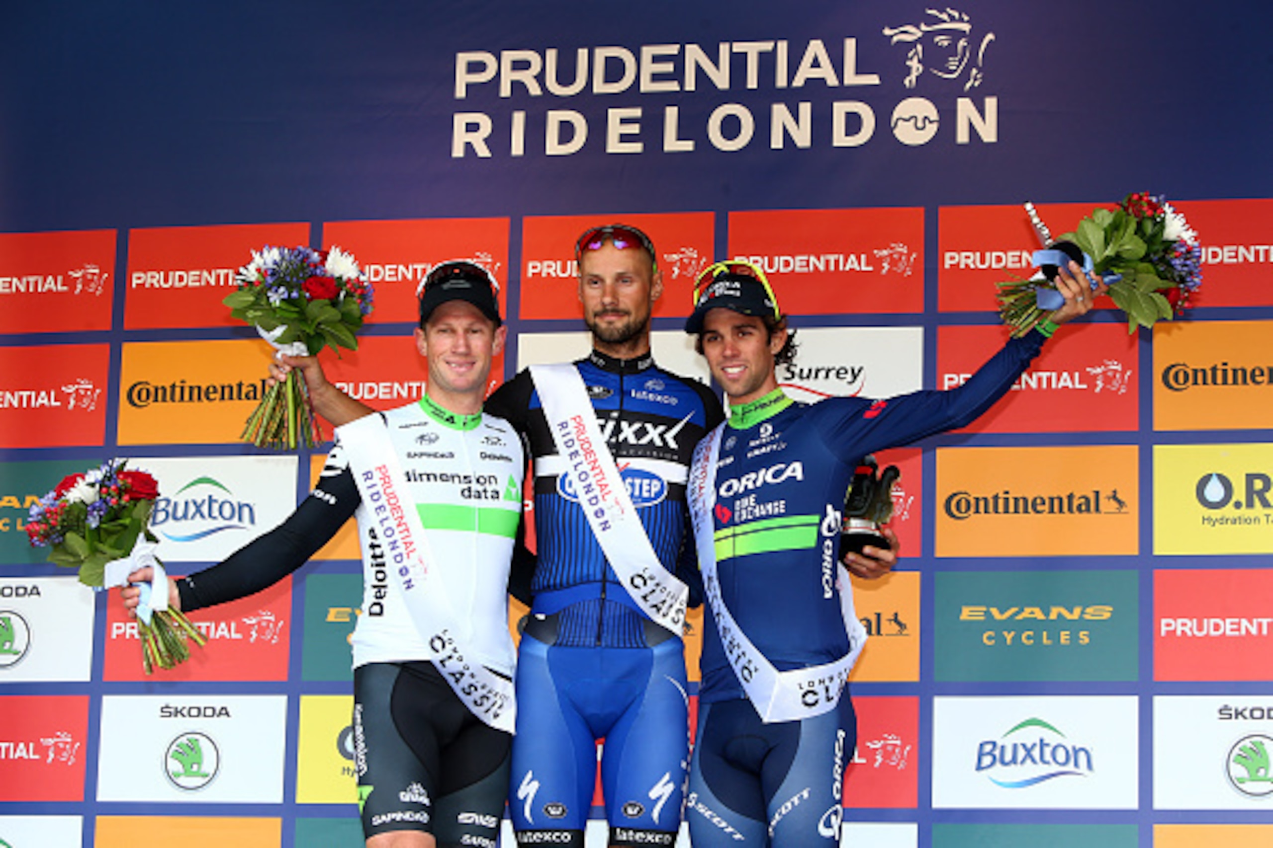 LONDON, ENGLAND - JULY 31: Belgium's Tom Boonen (C) of Etixx - Quick Step celebrates after winning the sprint  with second place Mark Renshaw (L) of Team Dimension Data and Michael Matthews of Orica BikeExchange in third during the Prudential RideLondon S