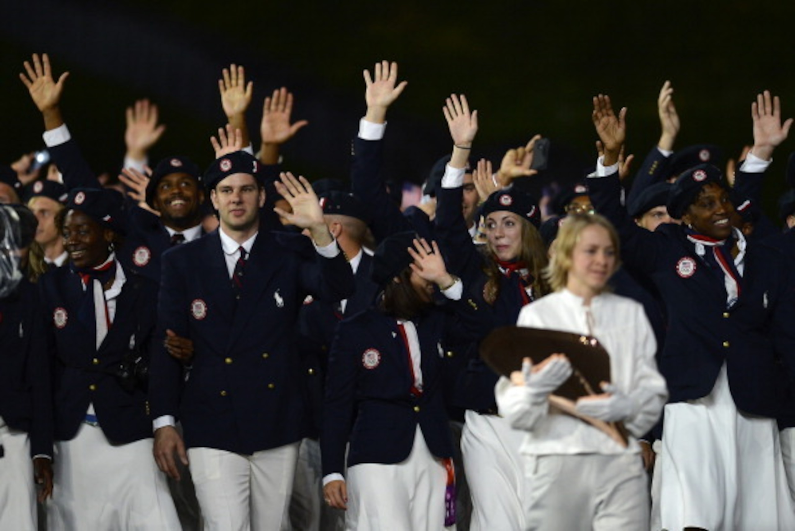 Members of the US delegation parade during the opening ceremony of the London 2012 Olympic Games on July 27, 2012 at the Olympic Stadium in London.  AFP PHOTO / ADRIAN DENNIS        (Photo credit should read ADRIAN DENNIS/AFP/GettyImages)