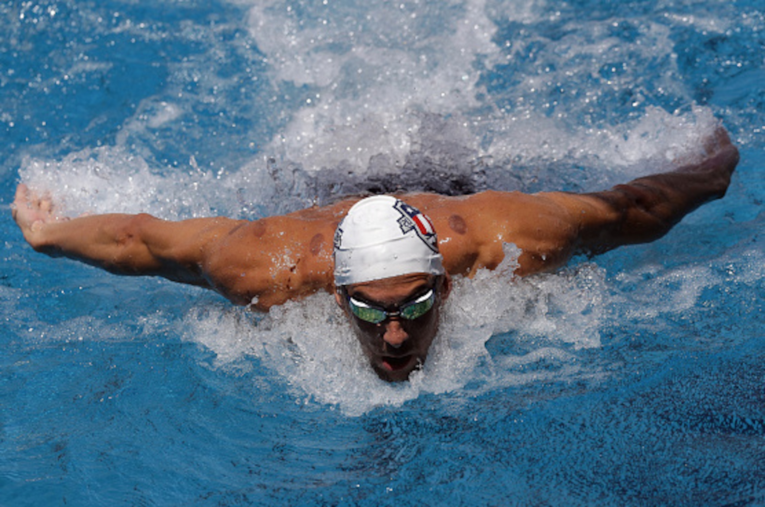 SAN ANTONIO, TX - JULY 16:  Michael Phelps trains during the 2016 U.S. Olympic Swimming Team Training Camp Media Day on July 16, 2016 in San Antonio, Texas.  (Photo by Ronald Martinez/Getty Images)