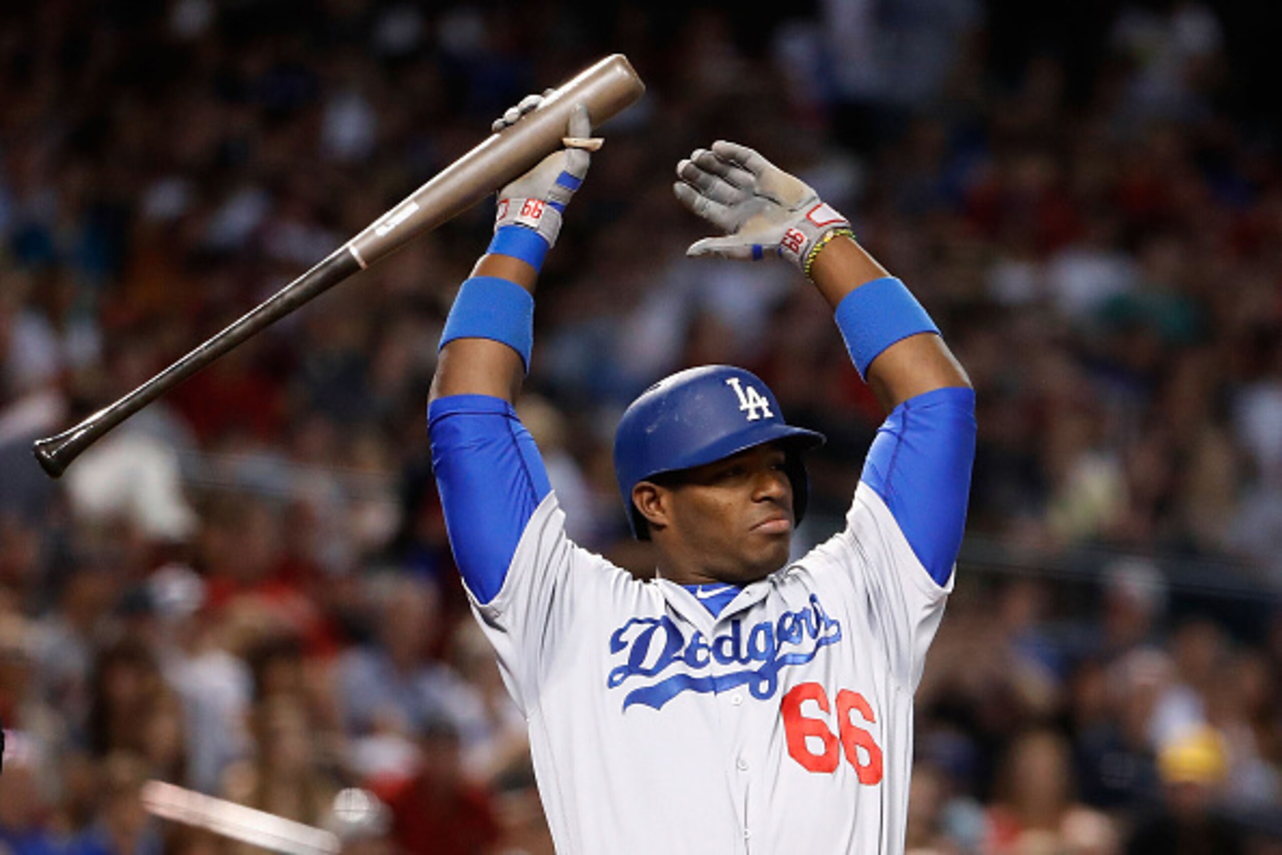 PHOENIX, AZ - JULY 16:  Yasiel Puig #66 of the Los Angeles Dodgers stretches as he bats against the Arizona Diamondbacks during the second inning of the MLB game at Chase Field on August 16, 2016 in Phoenix, Arizona.  (Photo by Christian Petersen/Getty Im
