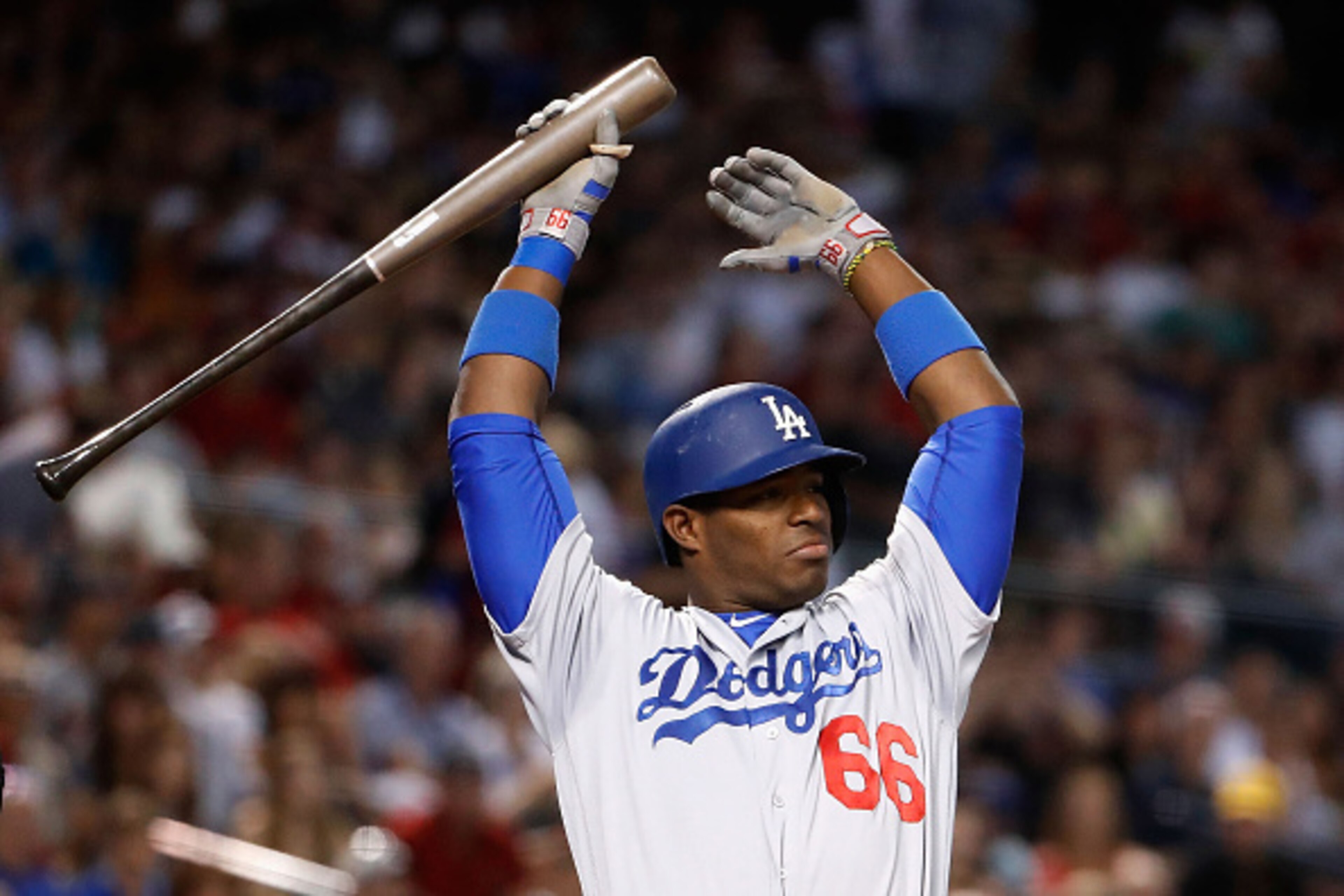 PHOENIX, AZ - JULY 16:  Yasiel Puig #66 of the Los Angeles Dodgers stretches as he bats against the Arizona Diamondbacks during the second inning of the MLB game at Chase Field on August 16, 2016 in Phoenix, Arizona.  (Photo by Christian Petersen/Getty Im