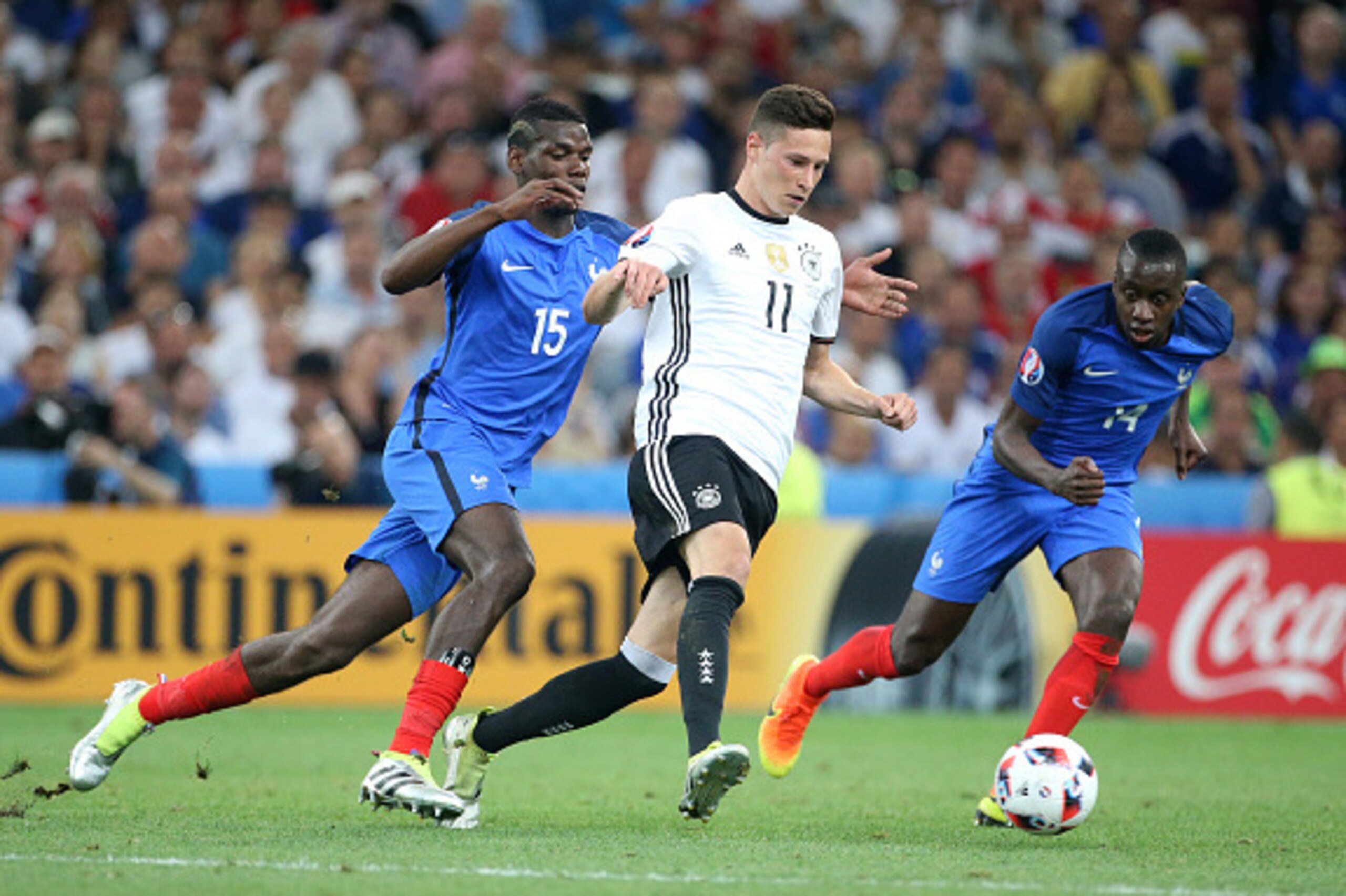 MARSEILLE, FRANCE - JULY 7: Julian Draxler of Germany in action between Paul Pogba and Blaise Matuidi of France during the UEFA Euro 2016 semi-final match between Germany and France at Stade Velodrome on July 7, 2016 in Marseille, France. (Photo by Jean C