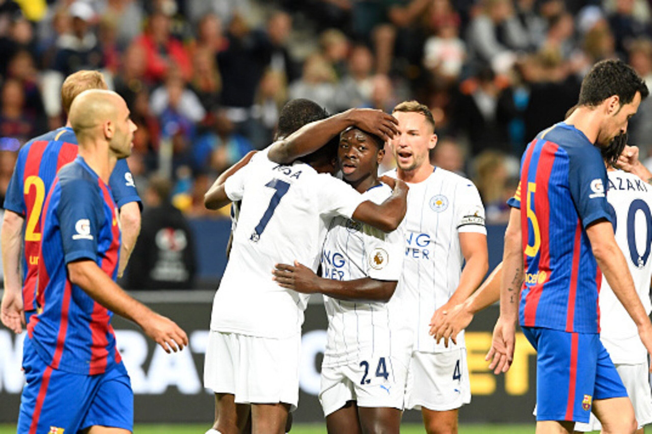 Leicester's Nigerian forward Ahmed Musa (2nd L) celebrates with his teammates after scoring a goal during the 2016 International Champions Cup friendly football match between FC Barcelona and Leicester City at Friends Arena on August 3, 2016 in Solna, Swe