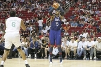 Aug 1, 2016; Houston, TX, USA; United States forward Carmelo Anthony (15) shoots against Nigeria forward Ike Diogu (6) in the second quarter during an exhibition basketball game  at Toyota Center. United States won 110 to 66. Mandatory Credit: Thomas B. S