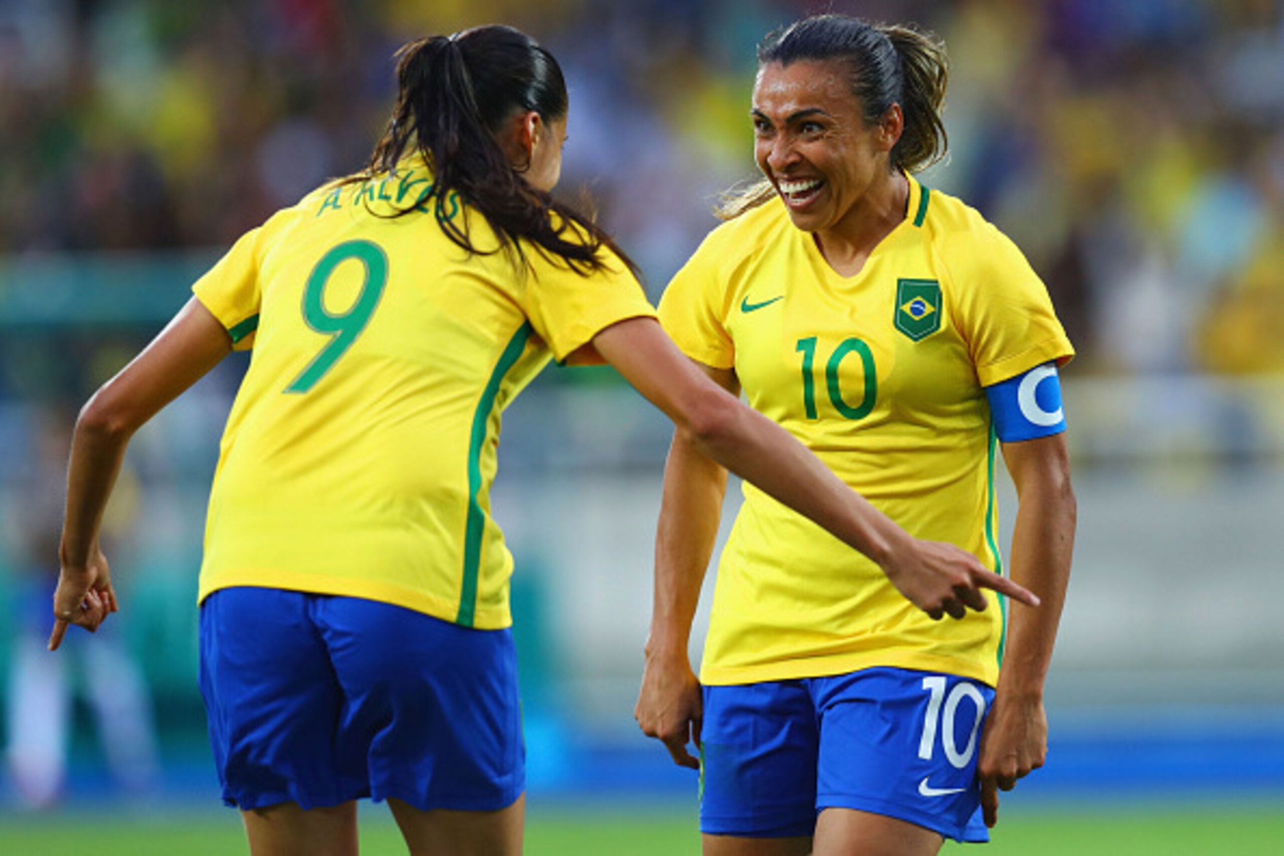RIO DE JANEIRO, BRAZIL - AUGUST 03:  Marta of Brazil (10) celebrates with Andressa Alves as she scores their second goal during the Women's Group E first round match between Brazil and China PR during the Rio 2016 Olympic Games at the Olympic Stadium on A