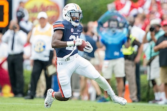 AUBURN, AL - SEPTEMBER 12: Running back Kerryon Johnson #21 of the Auburn Tigers carries the ball downfield during their game against the Jacksonville State Gamecocks on September 12, 2015 at Jordan-Hare Stadium in Auburn, Alabama. The Auburn Tigers defea