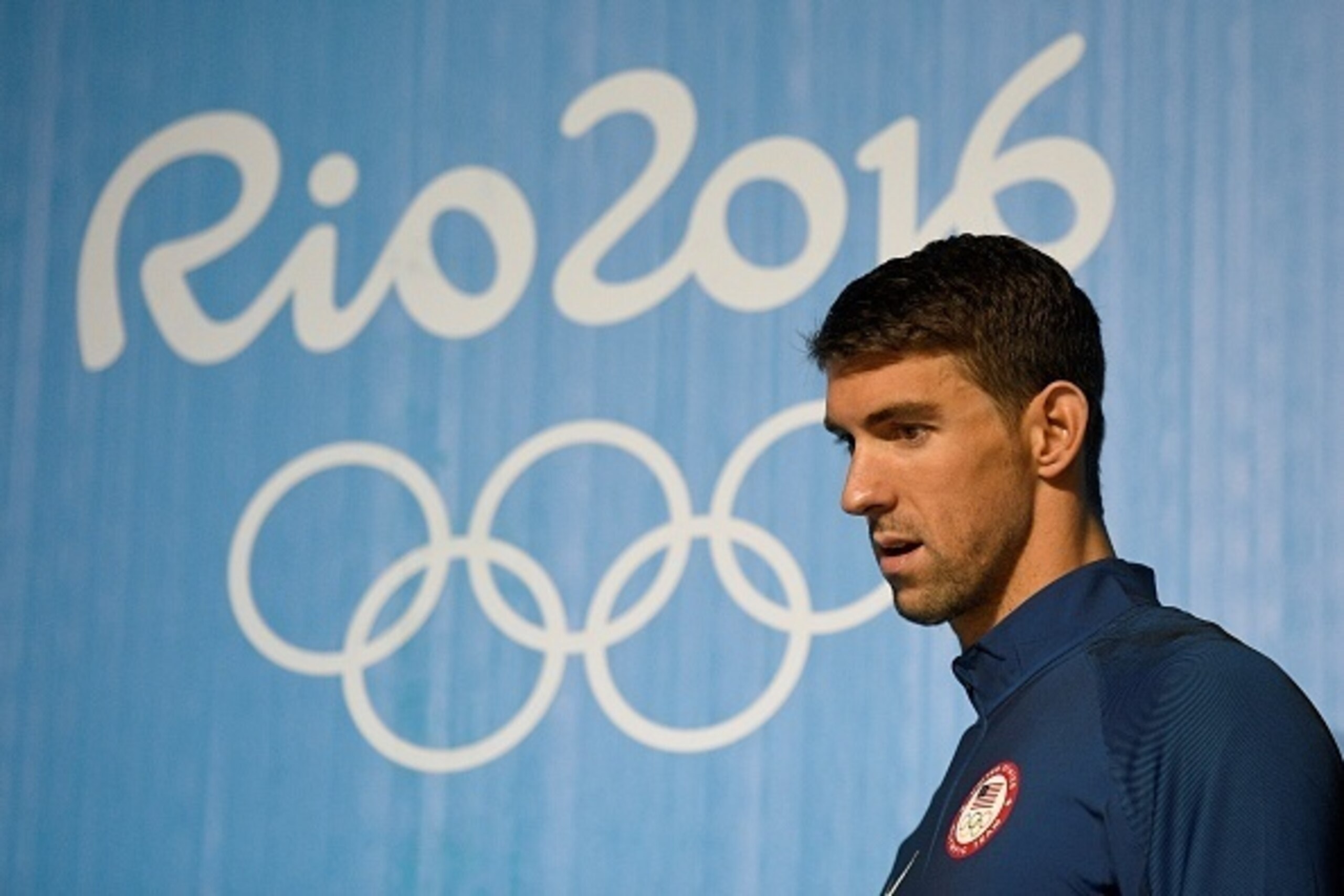 US swimmer Michael Phelps holds a press conference on August 3, 2016 in Rio de Janeiro, two days prior the opening ceremony of the Rio 2016 Olympic Games.
Phelps will carry the United States flag at the opening ceremony for the Olympics in Rio, the US Oly