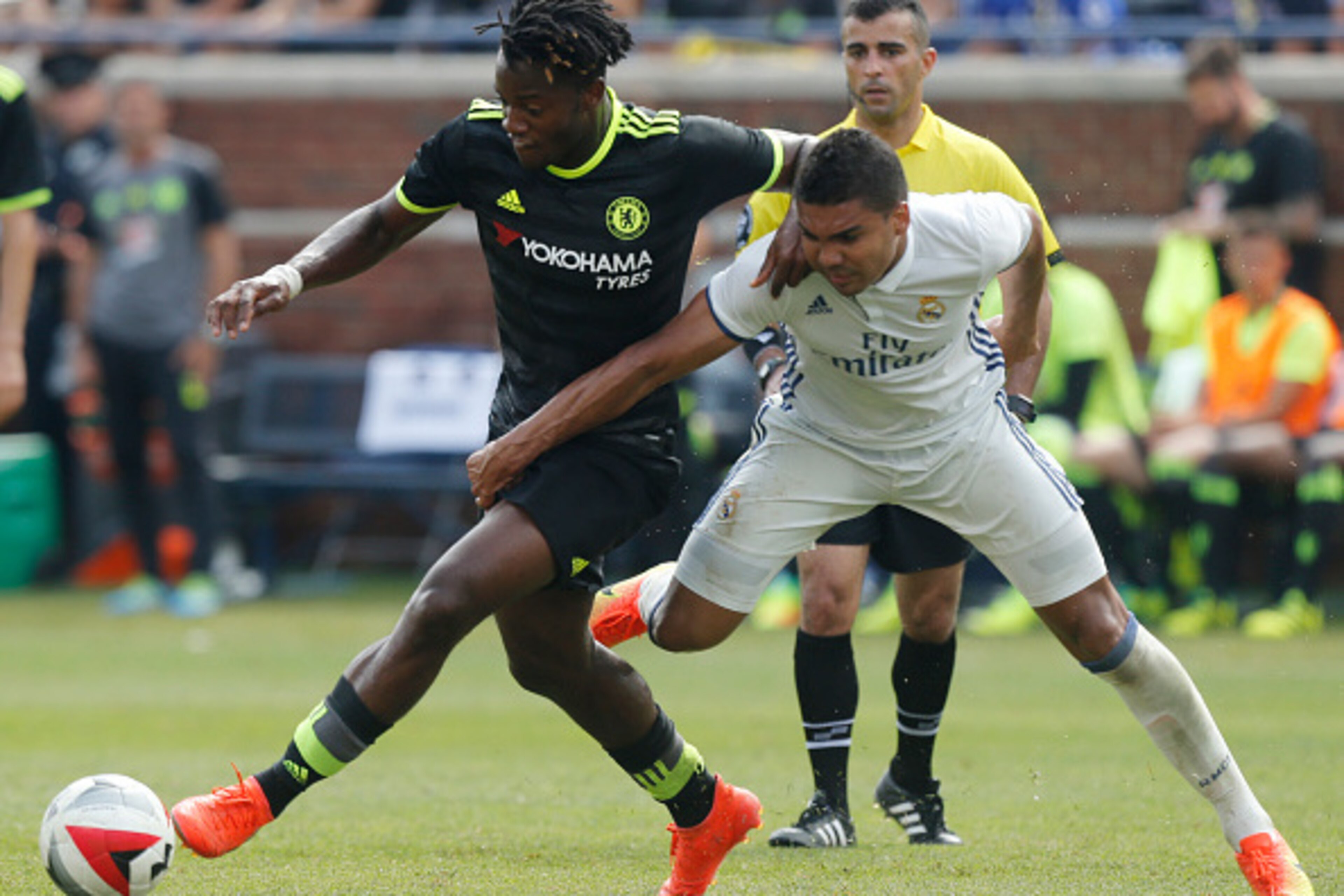 Real Madrid midfielder Carlos Henrique Casemiro (R) tries to steal the ball from Chelsea forward Michy Batshuayi (L) during an International Champions Cup soccer match in Ann Arbor, Michigan on July 30, 2016. / AFP / Jay LaPrete        (Photo credit shoul