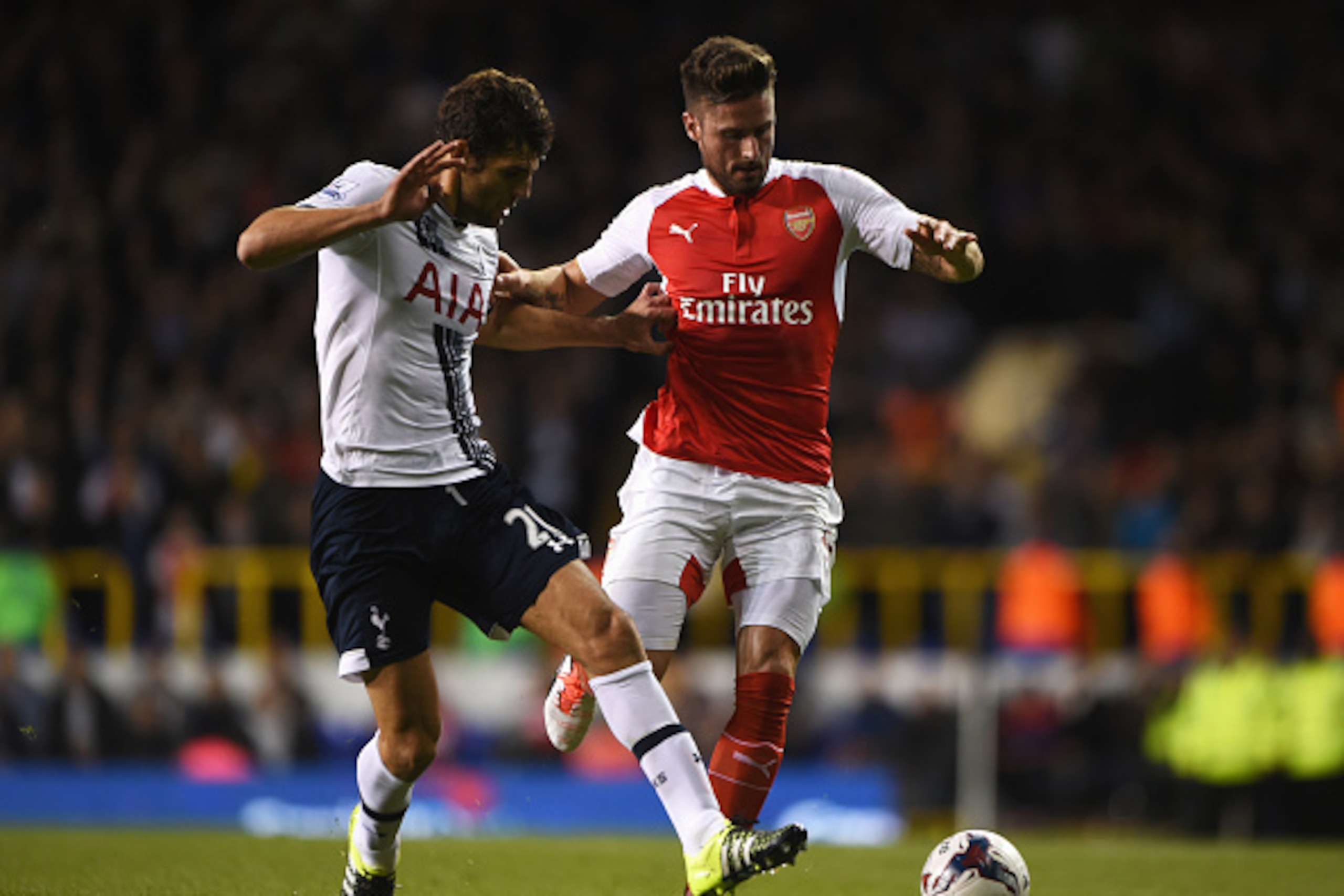 LONDON, ENGLAND - SEPTEMBER 23:  Olivier Giroud of Arsenal holds off Federico Fazio of Tottenham Hotspur during the Capital One Cup third round match between Tottenham Hotspur and Arsenal at White Hart Lane on September 23, 2015 in London, England.  (Phot