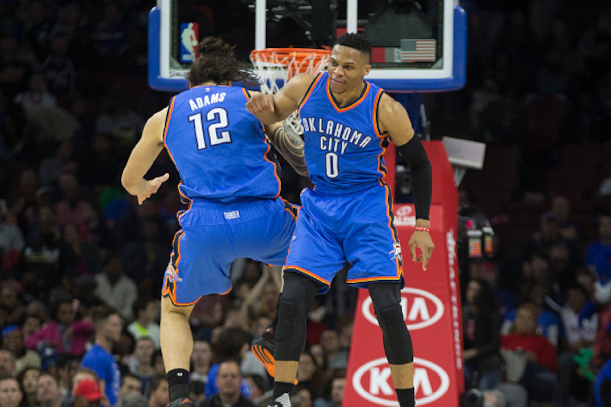 PHILADELPHIA, PA - MARCH 18: Russell Westbrook #0 and Steven Adams #12 of the Oklahoma City Thunder celebrate against the Philadelphia 76ers on March 18, 2016 at the Wells Fargo Center in Philadelphia, Pennsylvania. The Thunder defeated the 76ers 111-97. 