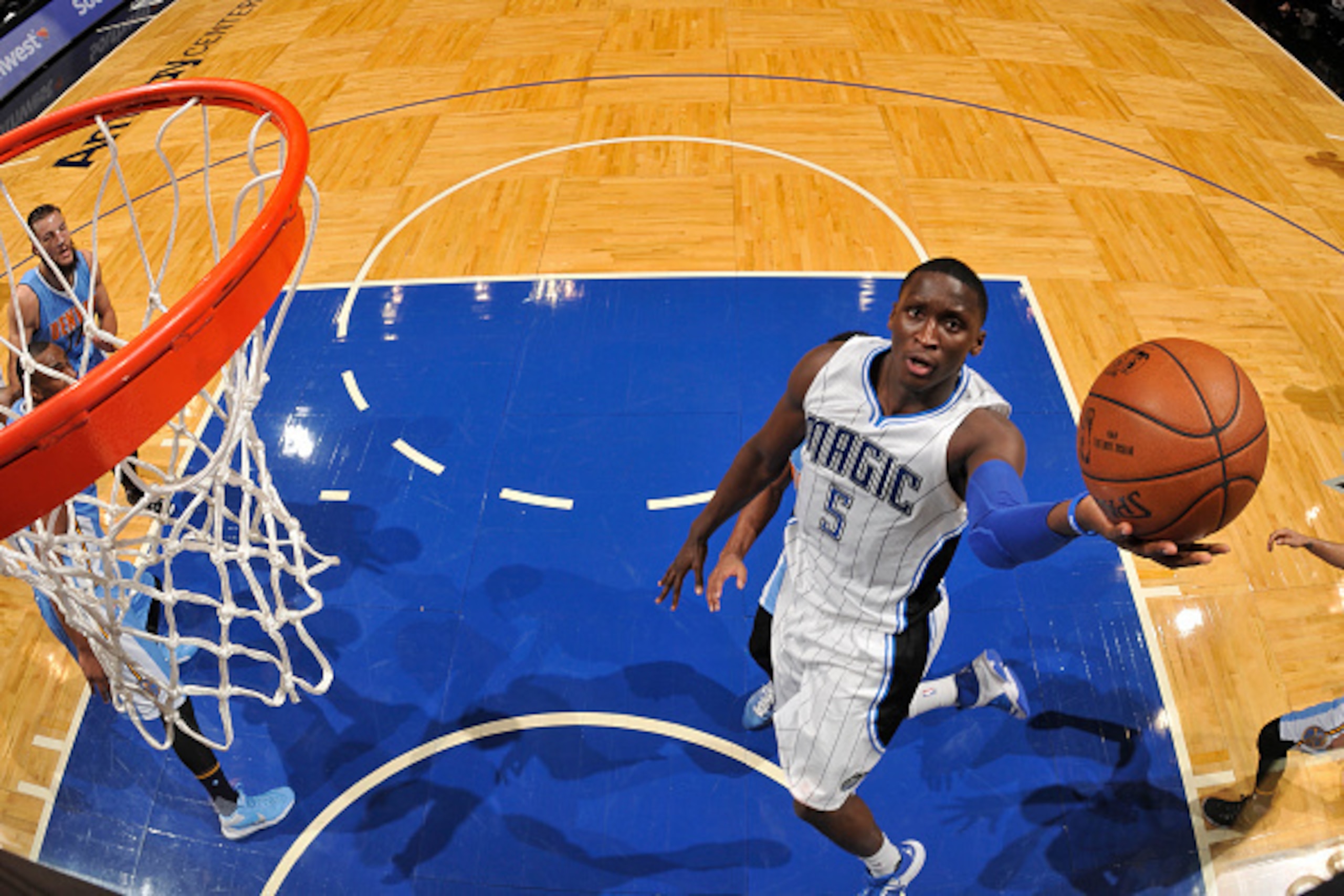 ORLANDO, FL - MARCH 15: Victor Oladipo #5 of the Orlando Magic shoots the ball against the Denver Nuggets  on March 15, 2016 at the Amway Center in Orlando, Florida. NOTE TO USER: User expressly acknowledges and agrees that, by downloading and or using th