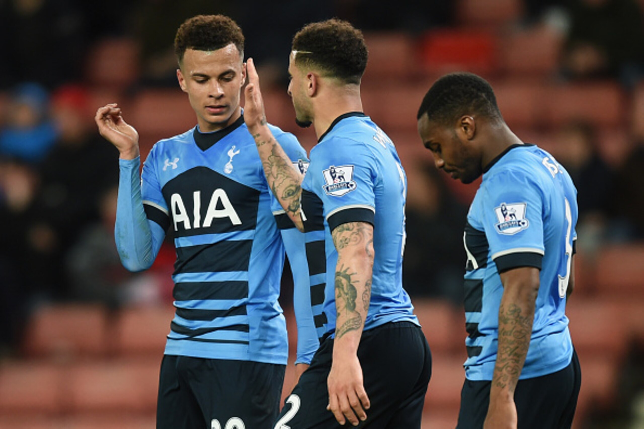 STOKE ON TRENT, ENGLAND - APRIL 18:  Dele Alli of Tottenham Hotspur (L) celebrates with Kyle Walker and Danny Rose as he scores their fourth goal and his second during the Barclays Premier League match between Stoke City and Tottenham Hotspur at the Brita
