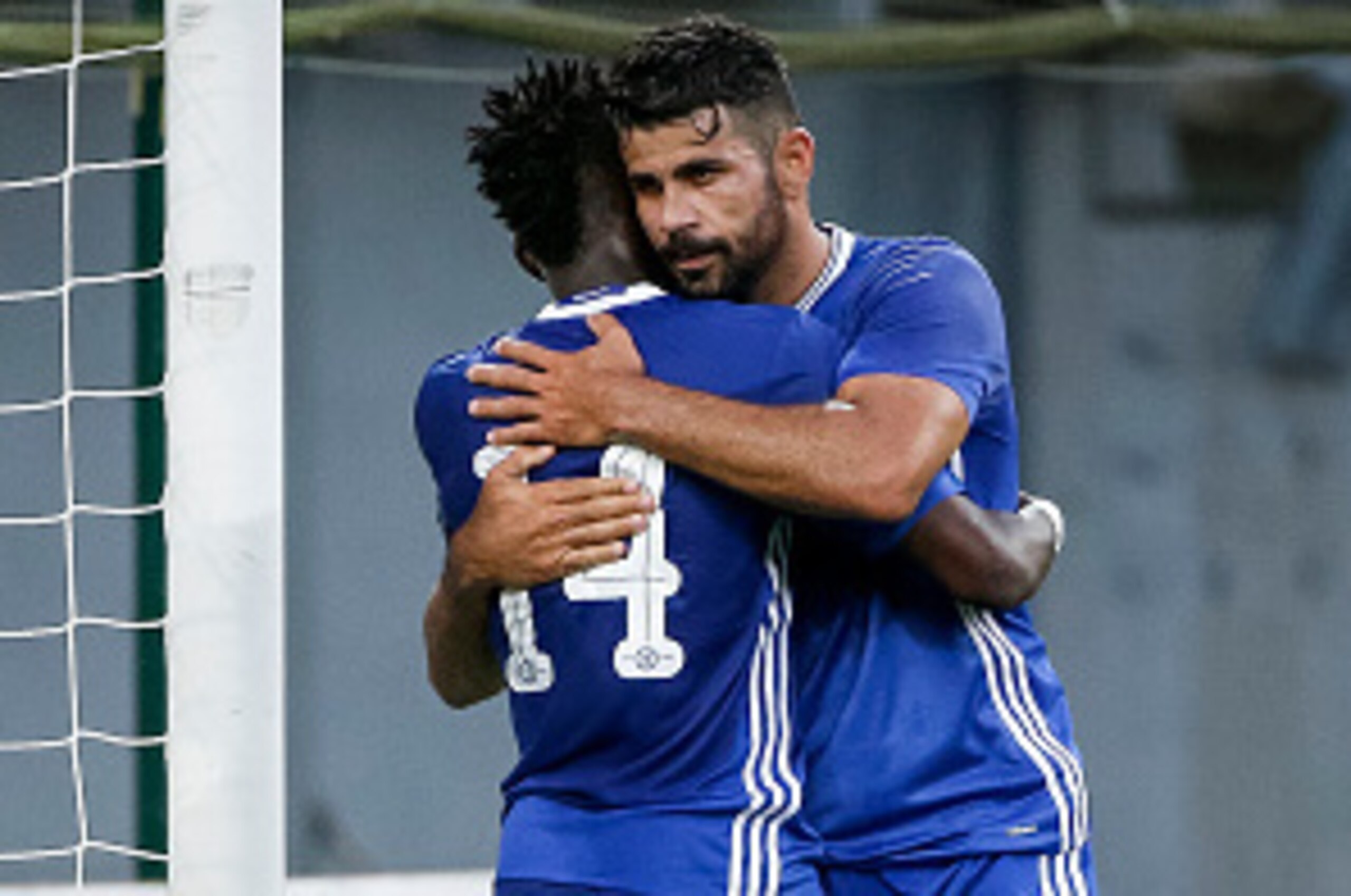 VELDEN, AUSTRIA - JULY 20:  Bertrand Traore (C) of Chelsea celebrate scoring a goal with the Diego Costa (R) near goalkeeper Alexander Kofler (L) of WAC RZ Pellets during the international friendly match between WAC RZ Pellets and Chelsea F.C. at Worthers