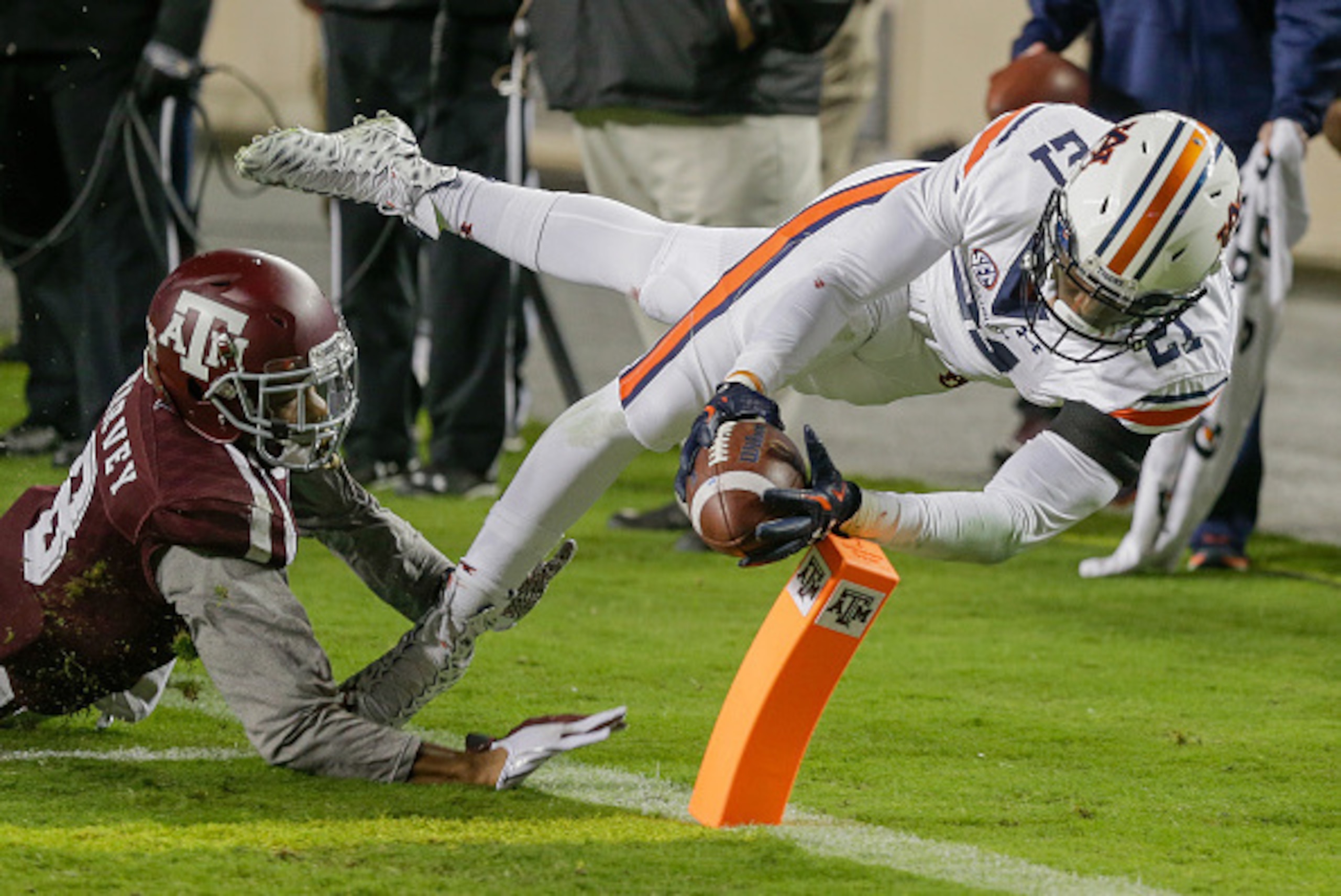 COLLEGE STATION, TX - NOVEMBER 07:  Kerryon Johnson #21 of the Auburn Tigers steps out of bounds before crossing ther goal line as Nick Harvey #8 of the Texas A&M Aggies pushes him out in the first half at Kyle Field on November 7, 2015 in College Station