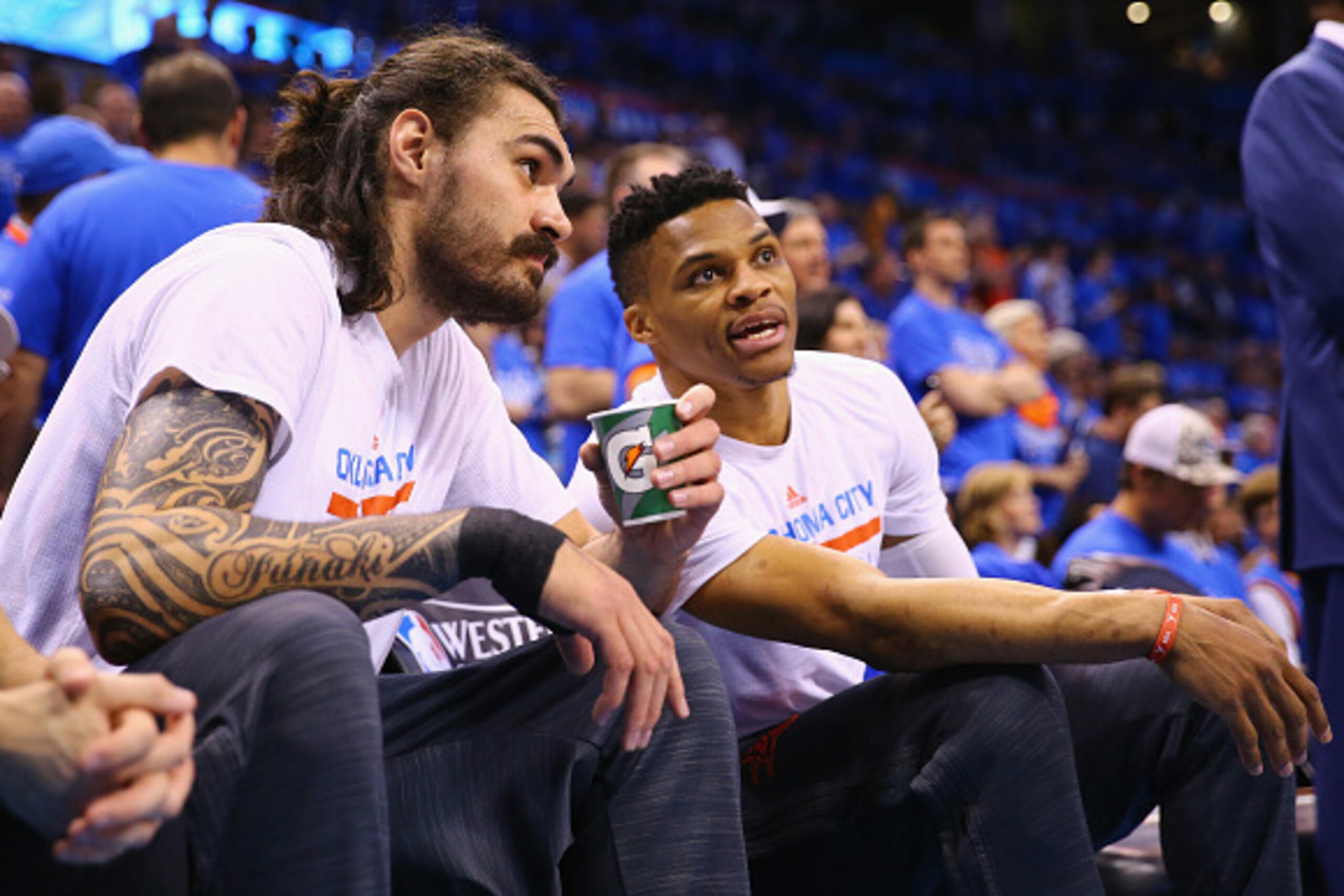 OKLAHOMA CITY, OK - MAY 28:  Steven Adams #12 of the Oklahoma City Thunder and Russell Westbrook #0 talk prior to game six of the Western Conference Finals against the Golden State Warriors during the 2016 NBA Playoffs at Chesapeake Energy Arena on May 28