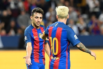 Barcelona's Spanish Forward Munir El Haddadi (L) celebrates with his teammate Argentinian forward Lionel Messi after scoring a goal during the 2016 International Champions Cup football match between FC Barcelona and Leicester City at Friends Arena on Augu