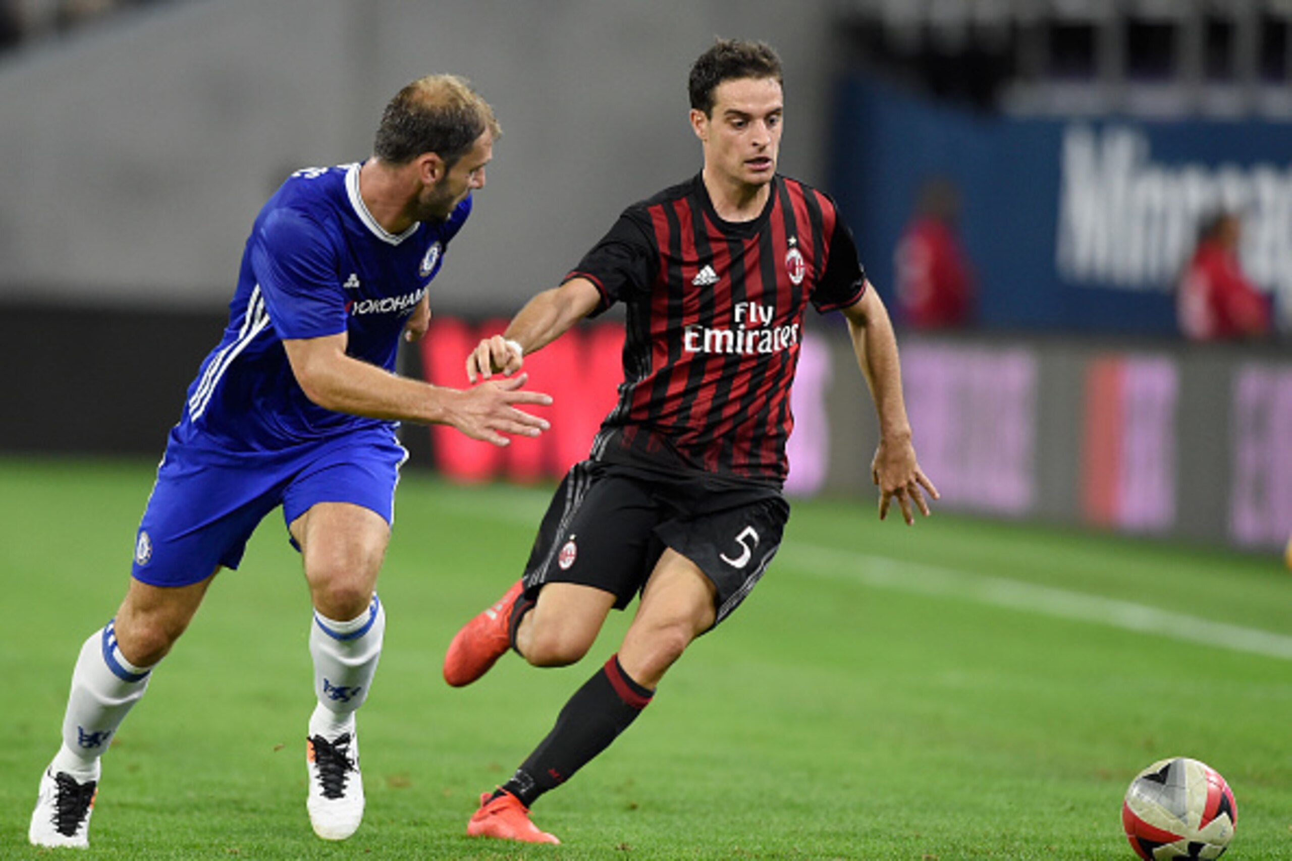 MINNEAPOLIS, MN - AUGUST 3: Branislav Ivanovic #2 of Chelsea and Giacomo Bonaventura #5 of AC Milan go after the ball during the second half of the International Champions Cup match on August 3, 2016 at U.S. Bank Stadium in Minneapolis, Minnesota. Chelsea