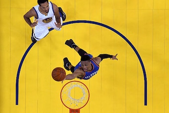 OAKLAND, CA - MAY 30:  Russell Westbrook #0 of the Oklahoma City Thunder goes up for a layup in front of Shaun Livingston #34 of the Golden State Warriors in Game Seven of the Western Conference Finals during the 2016 NBA Playoffs at ORACLE Arena on May 3