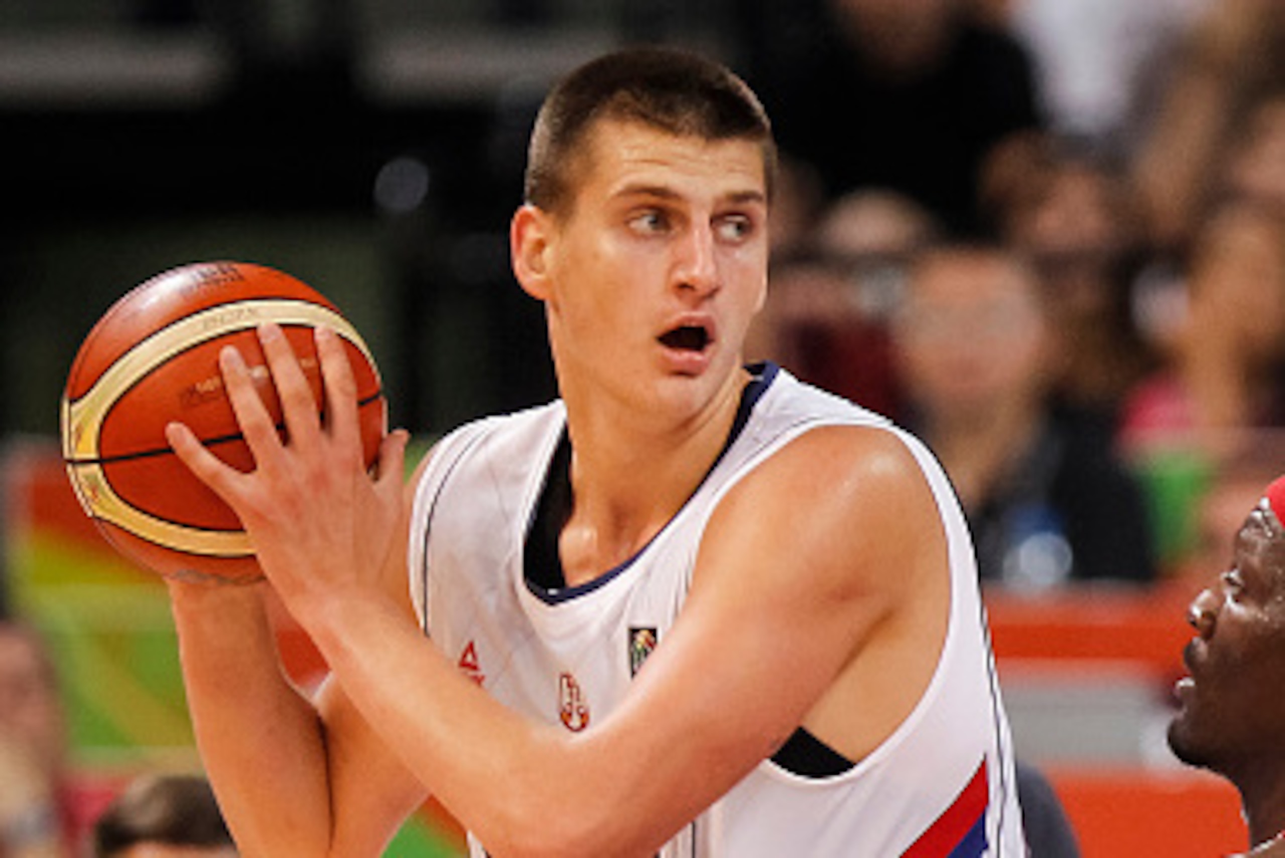 BELGRADE, SERBIA - JULY 04: Nikola Jokic (L) of Serbia in action against Ramon Clemente (R) of Puerto Rico during the 2016 FIBA World Olympic Qualifying basketball Group A match between Serbia and Puerto Rico at Kombank Arena on July 04, 2016 in Belgrade,