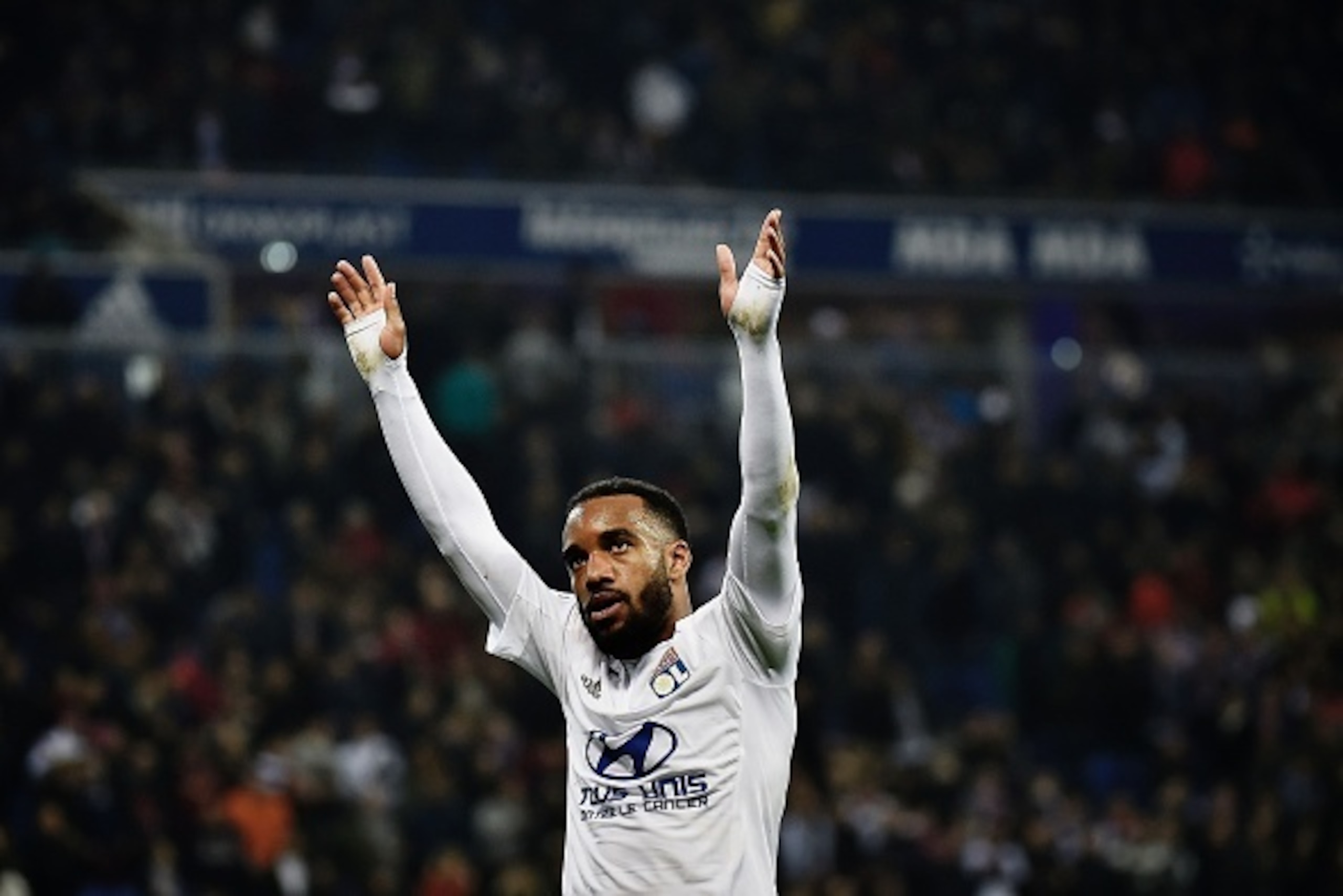Lyon's French forward Alexandre Lacazette celebrates after scoring a goal during the French L1 football match between Lyon and Nantes at the New Stadium in Decines-Charpieu, central-eastern France, on March 19, 2016. AFP PHOTO / JEFF PACHOUD / AFP / JEFF 