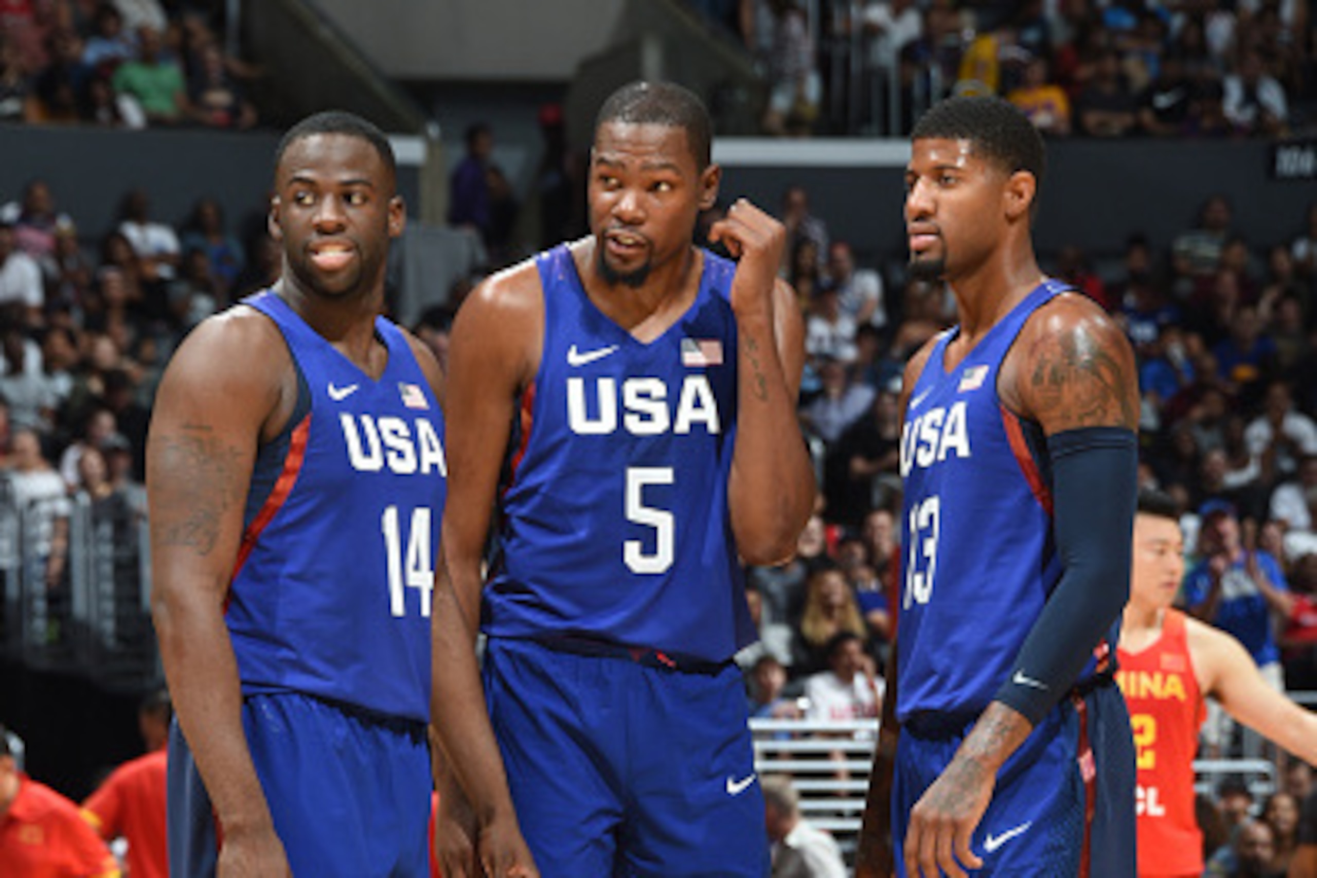 LOS ANGELES, CA - JULY 24: Draymond Green #14, Kevin Durant #5 and Paul George #13 of the USA Basketball Men's National Team are seen against China at the Staples Center in Los Angeles, California. NOTE TO USER: User expressly acknowledges and agrees that