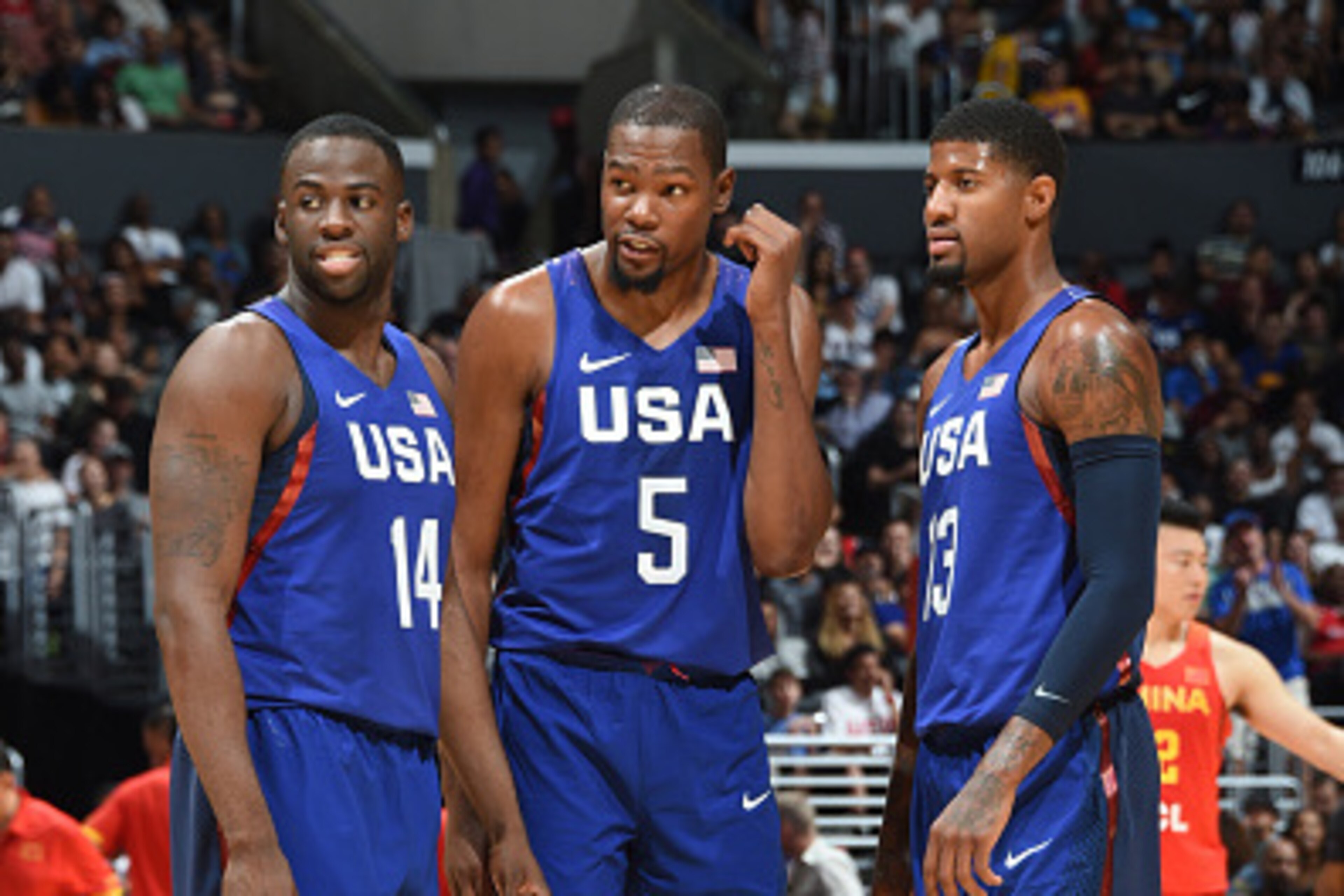 LOS ANGELES, CA - JULY 24: Draymond Green #14, Kevin Durant #5 and Paul George #13 of the USA Basketball Men's National Team are seen against China at the Staples Center in Los Angeles, California. NOTE TO USER: User expressly acknowledges and agrees that