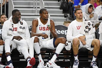 LAS VEGAS, NV - JULY 22:  (L-R) Draymond Green #14, Kevin Durant #5 and Klay Thompson #11 of the United States sit on the bench during a USA Basketball showcase exhibition game against Argentina at T-Mobile Arena on July 22, 2016 in Las Vegas, Nevada. The