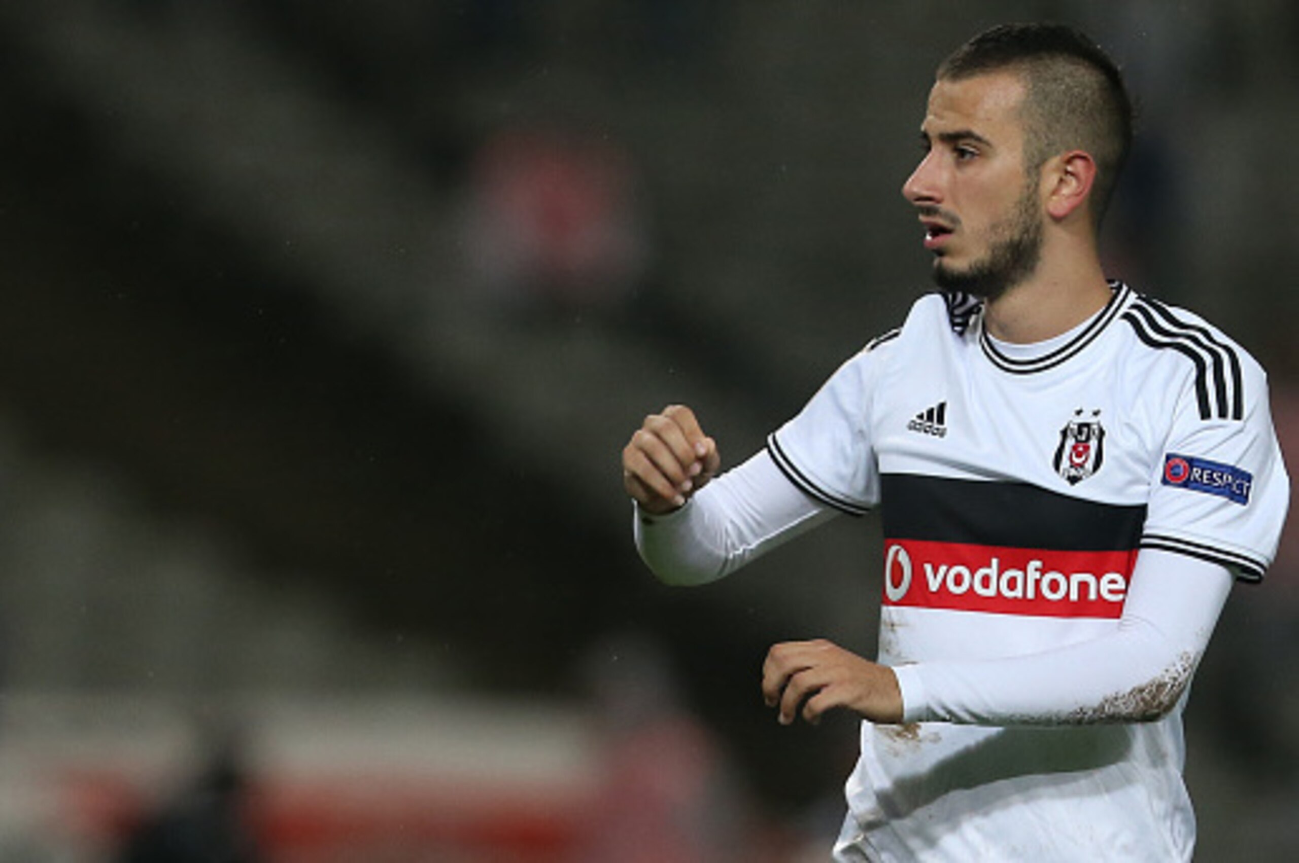 ISTANBUL, TURKEY -  SEPTEMBER 18: Oguzhan Ozyakup of Besiktas in action during the UEFA Europa League Group C match between Besiktas JK and Asteras Tripolis FC at the Ataturk Olympic Stadium in Istanbul, on September 18, 2014 in Istanbul,Turkey. (Photo by