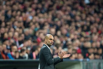 Bayern Munich's coach Pep Guardiola reacts during the UEFA Champions League semi-final, second-leg football match between FC Bayern Munich and Atletico Madrid in Munich, southern Germany, on May 3, 2016. / AFP / JOHN MACDOUGALL        (Photo credit should