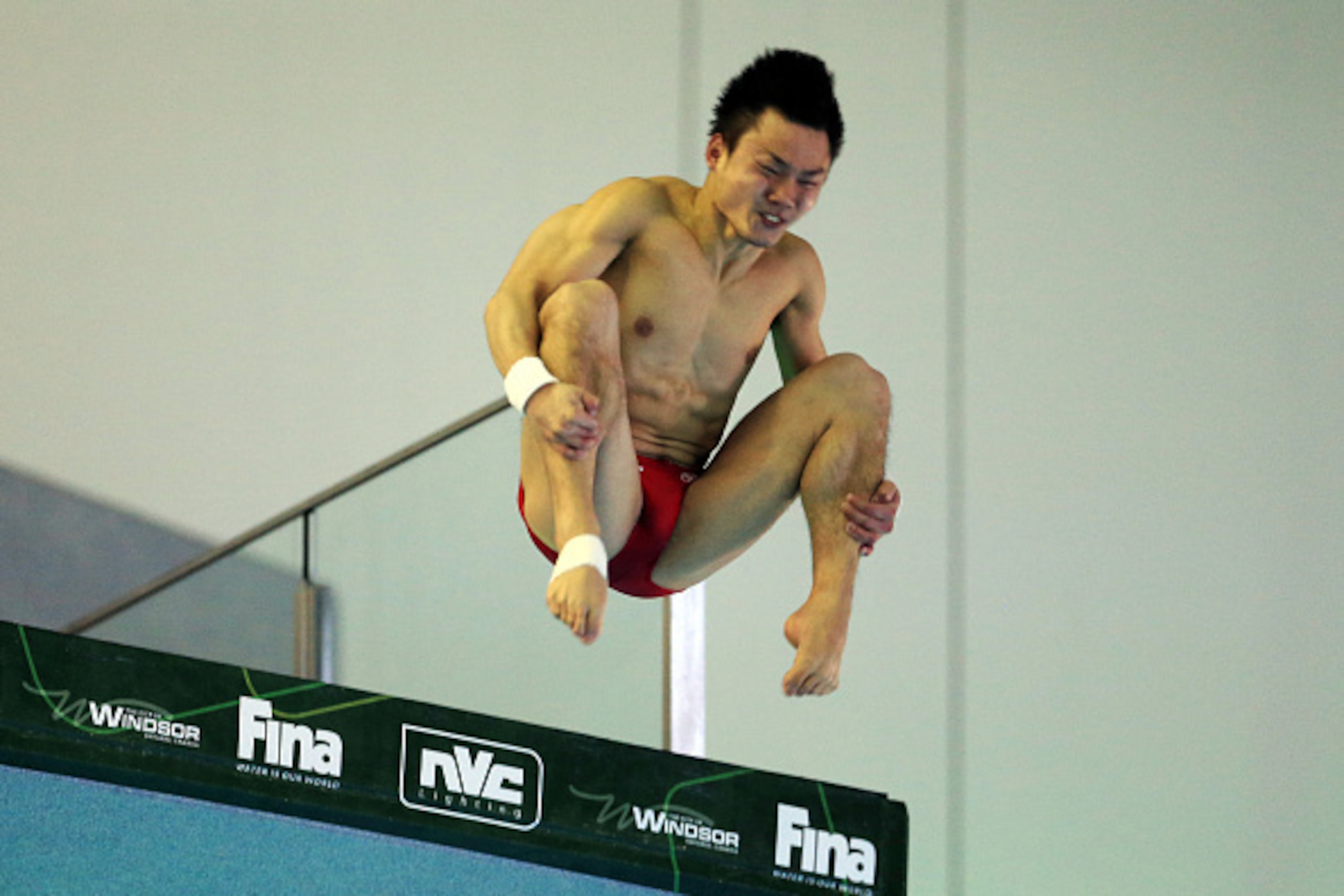 WINDSOR, ON - APRIL 17:  Qiu Bo of China competes in the Men's 10m Semifinals during Day Three of the FINA/NVC Diving World Series 2016 at the Windsor International Aquatic and Training Centre on April 17, 2016 in Windsor, Ontario, Canada.  (Photo by Vaug