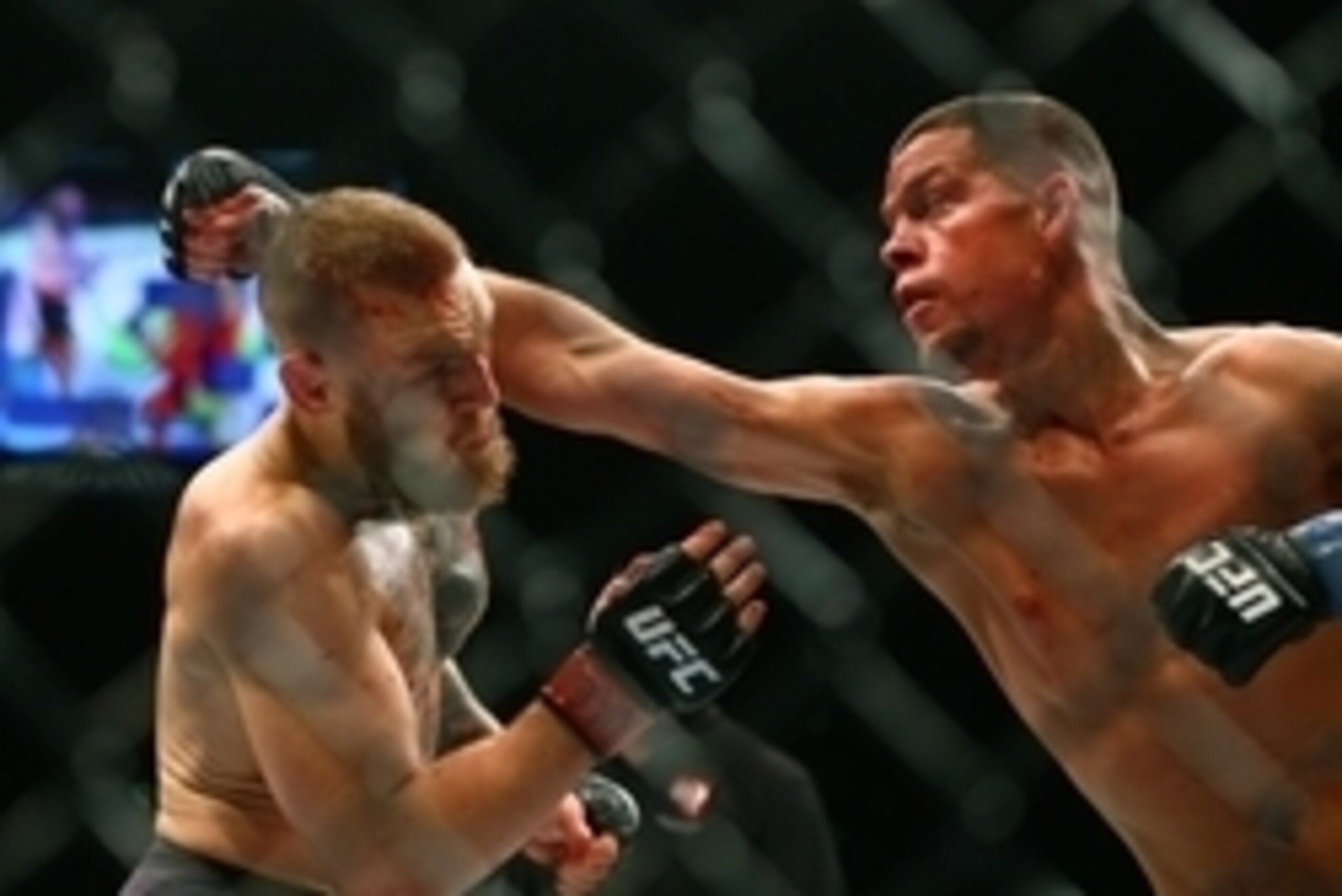 March 5, 2016; Las Vegas, NV, USA; Nate Diaz (right) against Conor McGregor during UFC 196 at MGM Grand Garden Arena. Mandatory Credit: Mark J. Rebilas-USA TODAY Sports