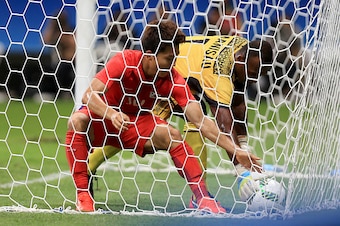 SALVADOR, BAHIA - AUGUST 04:  Seungwoo Ryu of Korea runs into the goal after scoring against Simione Tamanisau of Fiji during the Men's Group C first round match between Korea and Fiji during the Rio 2016 Olympic Games at Arena Fonte Nova on August 4, 201