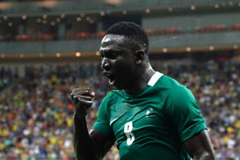 Nigeria's player Oghenekaro Etebo (8) celebrates the team's third goal against Japan during the Rio 2016 Olympic Games mens First Round Group B football match Nigeria vs Japan, at the Amazonia Arena in Manaus on August 4, 2016. / AFP / RAPHAEL ALVES      