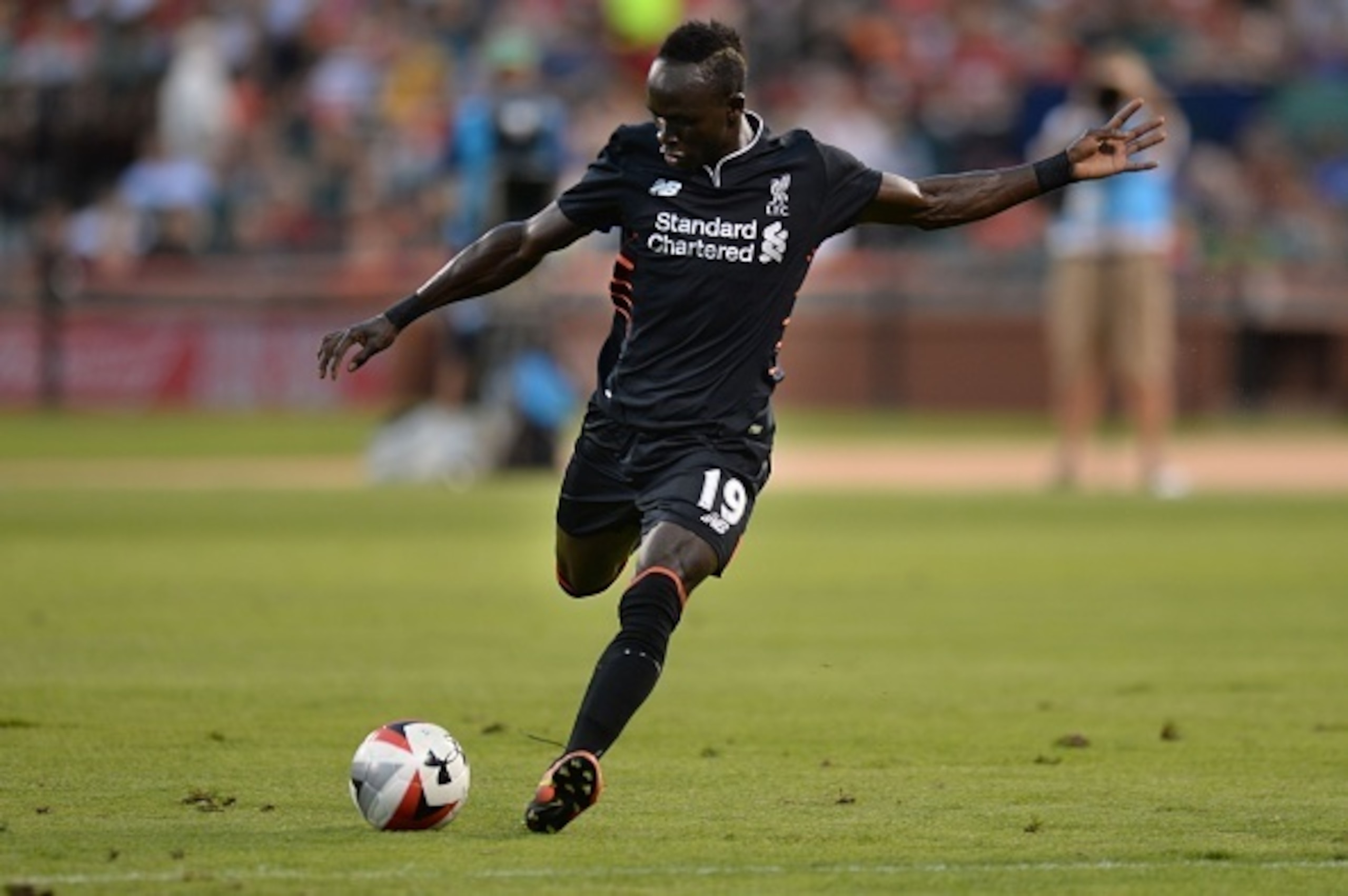 Liverpool midfielder Sadio Mane (19) kicks the ball during their friendly soccer against Roma match at Busch Stadium in St. Louis, Missouri on August 1, 2016. / AFP / Michael B. Thomas        (Photo credit should read MICHAEL B. THOMAS/AFP/Getty Images)