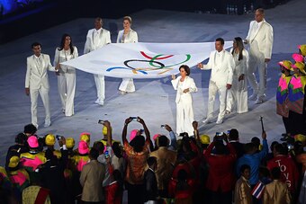RIO DE JANEIRO, BRAZIL - AUGUST 05: Flag bearers Marta, Ellen Gracie, Sandra Pires Tavares, Oscar Schmidt, Joaquim Cruzm, Rosa Celia Pimentel, Torben Grael and Emanuel Rego walks with the Olympic Flag during the Opening Ceremony of the Rio 2016 Olympic Ga
