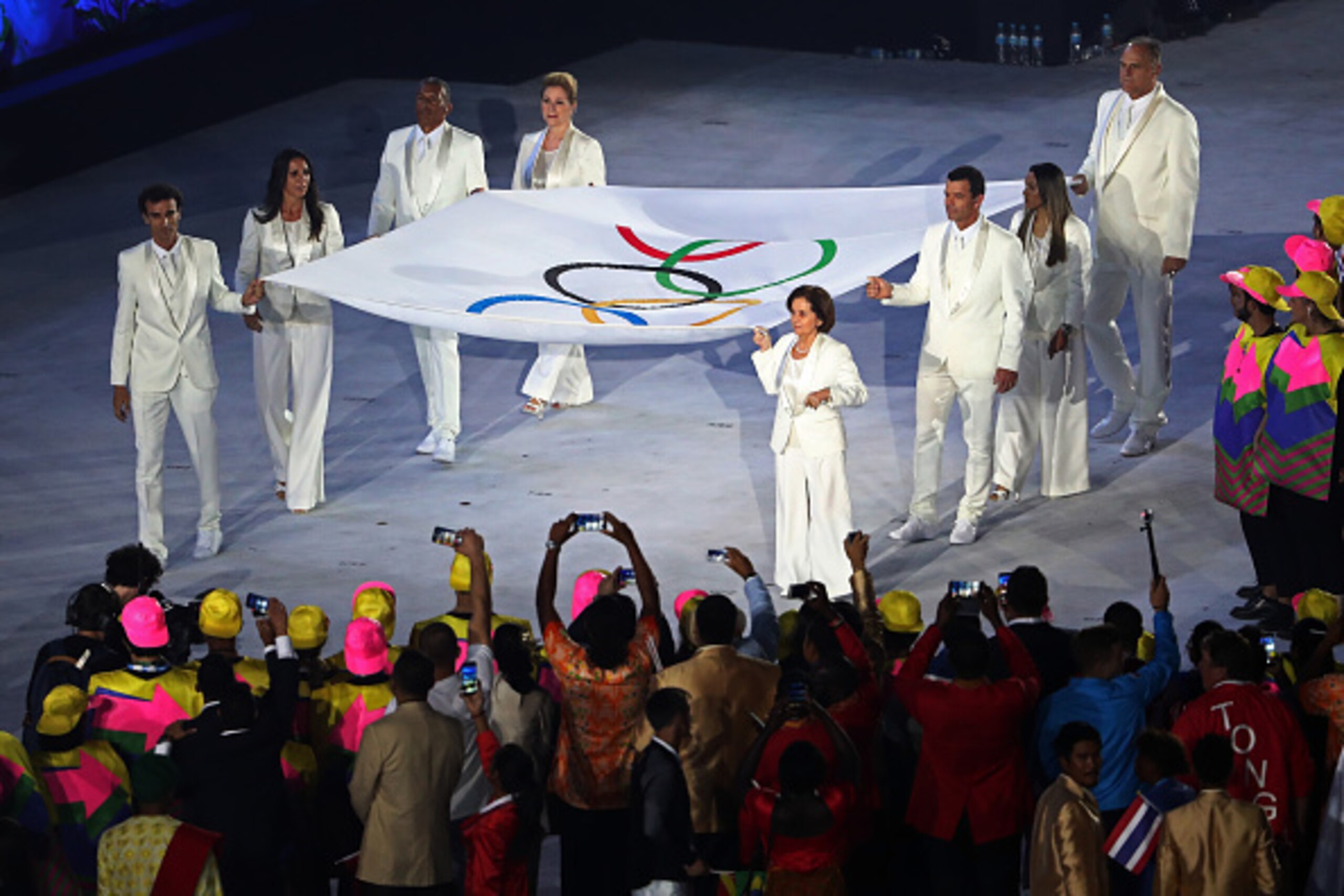 RIO DE JANEIRO, BRAZIL - AUGUST 05: Flag bearers Marta, Ellen Gracie, Sandra Pires Tavares, Oscar Schmidt, Joaquim Cruzm, Rosa Celia Pimentel, Torben Grael and Emanuel Rego walks with the Olympic Flag during the Opening Ceremony of the Rio 2016 Olympic Ga