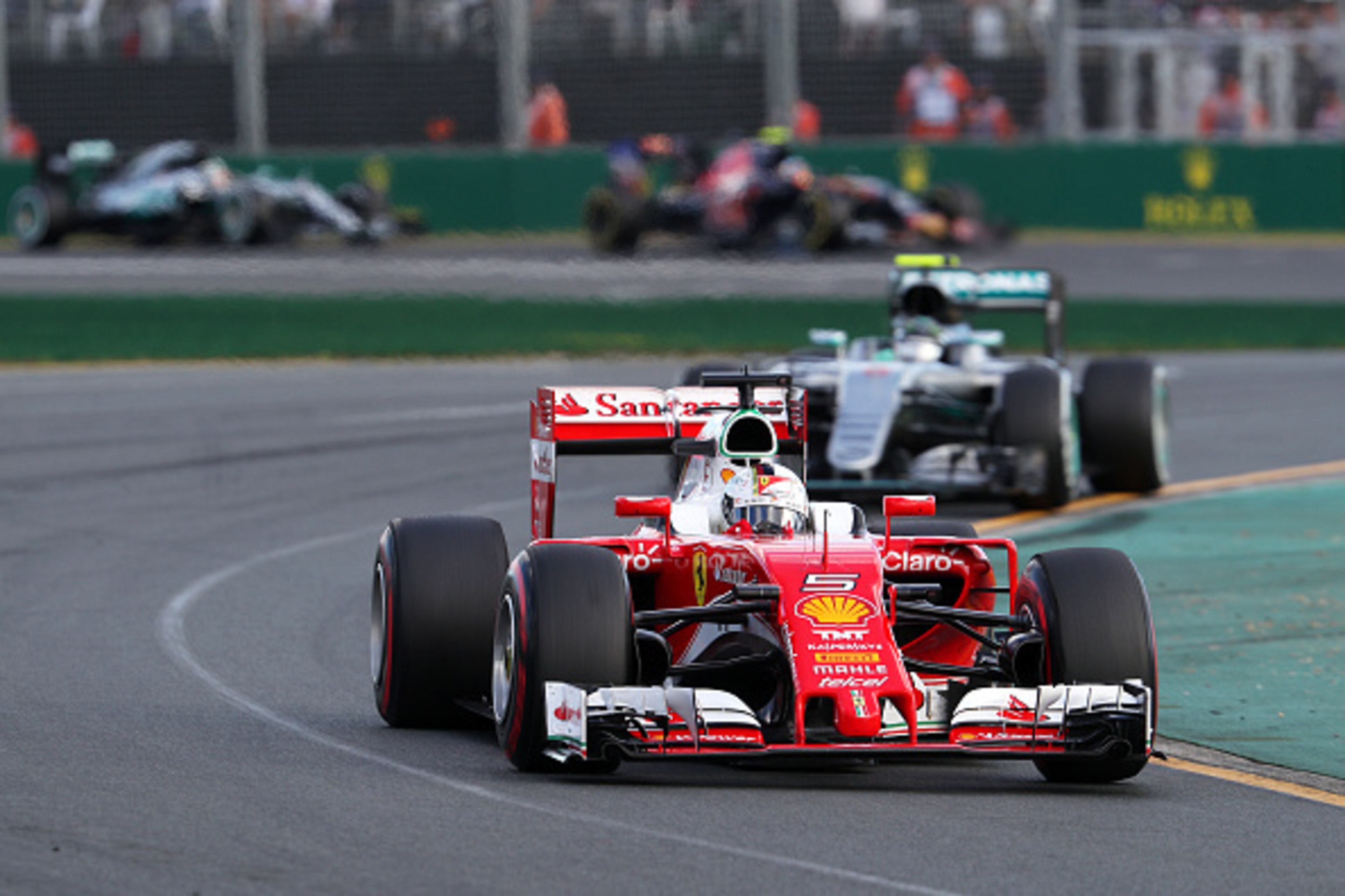 MELBOURNE, AUSTRALIA - MARCH 20: Sebastian Vettel of Germany and Ferrari drives ahead of Nico Rosberg of Germany and Mercedes GP during the Australian Formula One Grand Prix at Albert Park on March 20, 2016 in Melbourne, Australia. (Photo by Mark Thomps MELBOURNE, AUSTRALIA - MARCH 20: Sebastian Vettel of Germany and Ferrari drives ahead of Nico Rosberg of Germany and Mercedes GP during the Australian Formula One Grand Prix at Albert Park on March 20, 2016 in Melbourne, Australia. (Photo by Mark Thomps