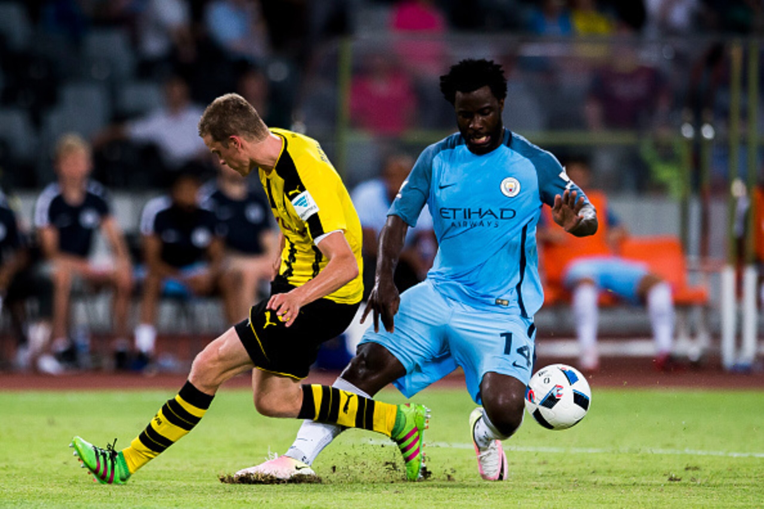 SHENZHEN - JULY 28: Manchester City striker Wilfried Bony (r) fights for the ball with Borussia Dortmund midfielder Sven Bender (l) during the match between Borussia Dortmund vs Manchester City FC at the 2016 International Champions Cup China match at the