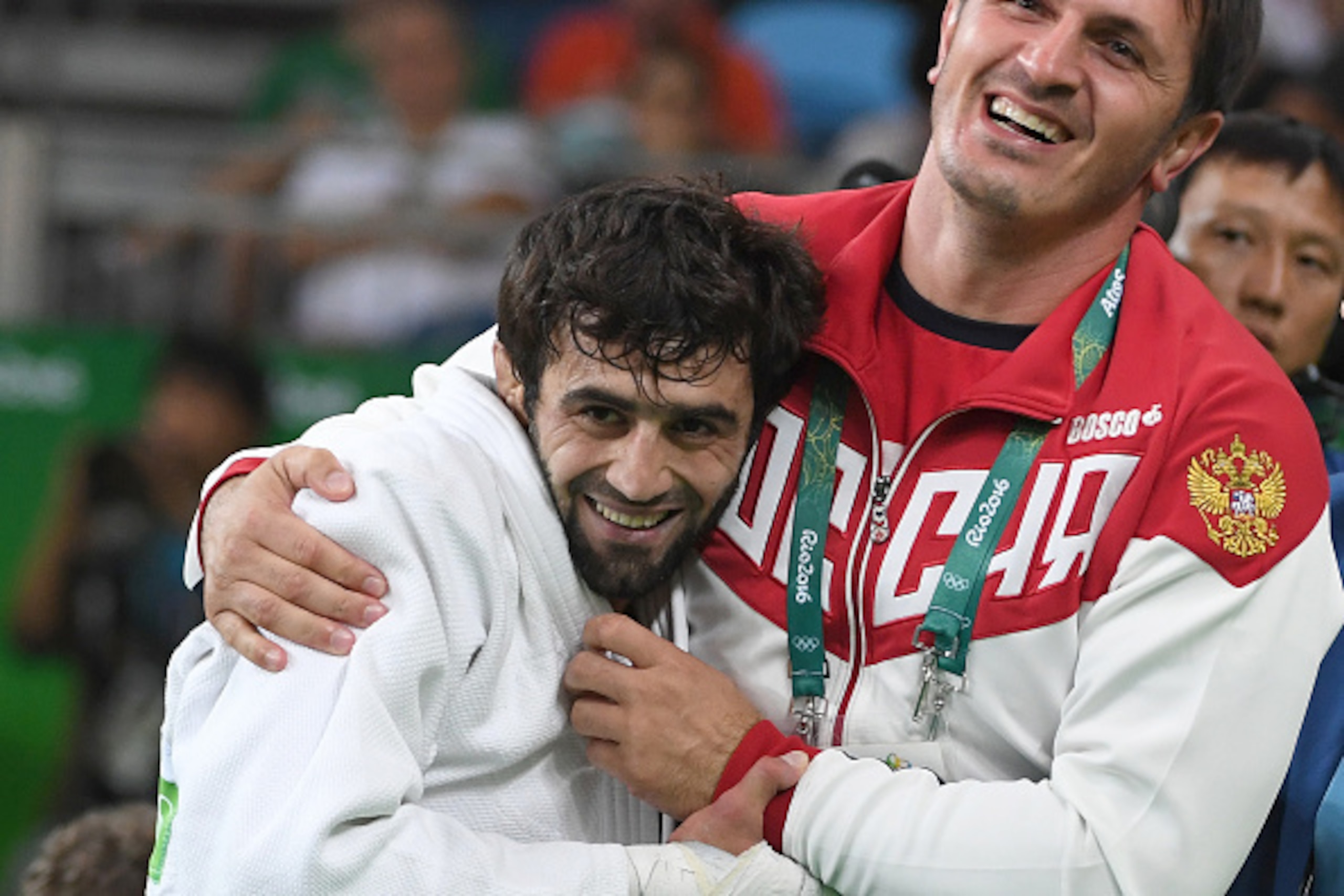 Russia's Beslan Mudranov (white) celebrates after defeating Kazakhstan's Yeldos Smetov during their men's -60kg judo contest gold medal match of the Rio 2016 Olympic Games in Rio de Janeiro on August 6, 2016. / AFP / Toshifumi KITAMURA        (Photo credi