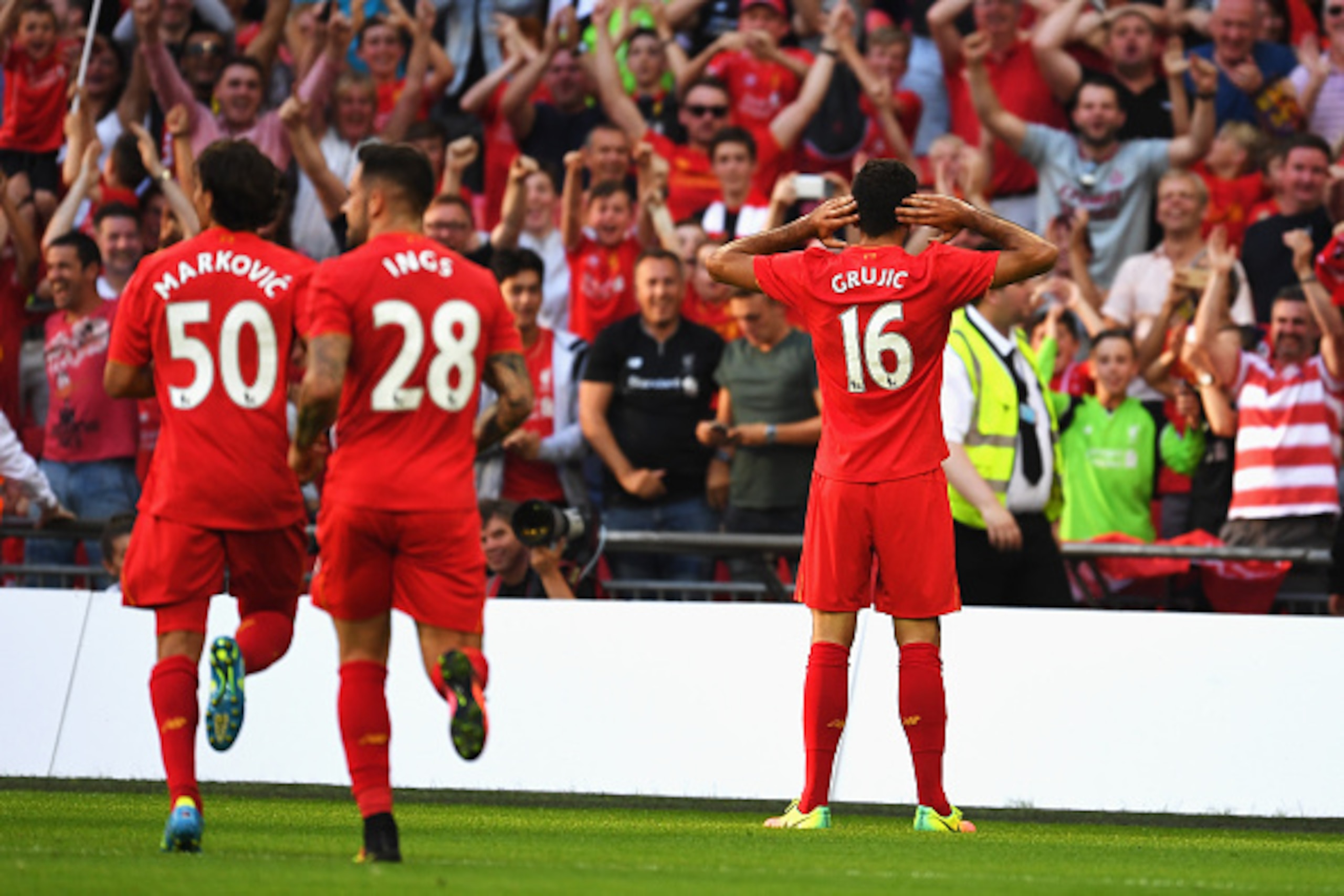 LONDON, ENGLAND - AUGUST 06: Marko Grujic of Liverpool celebrates scoring his team's fourth goal during the International Champions Cup match between Liverpool and Barcelona at Wembley Stadium on August 6, 2016 in London, England.  (Photo by Mike Hewitt/G