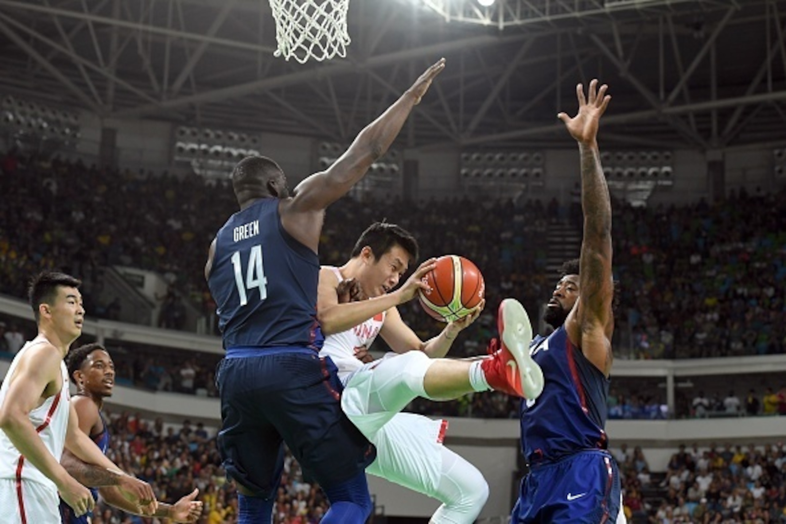 USA's forward Draymond Green(L) and USA's centre DeAndre Jordan (R) defends against China's small forward Ding Yanyuhang (C) during a Men's round Group A basketball match between China and USA at the Carioca Arena 1 in Rio de Janeiro on August 6, 2016 dur USA's forward Draymond Green(L) and USA's centre DeAndre Jordan (R) defends against China's small forward Ding Yanyuhang (C) during a Men's round Group A basketball match between China and USA at the Carioca Arena 1 in Rio de Janeiro on August 6, 2016 dur
