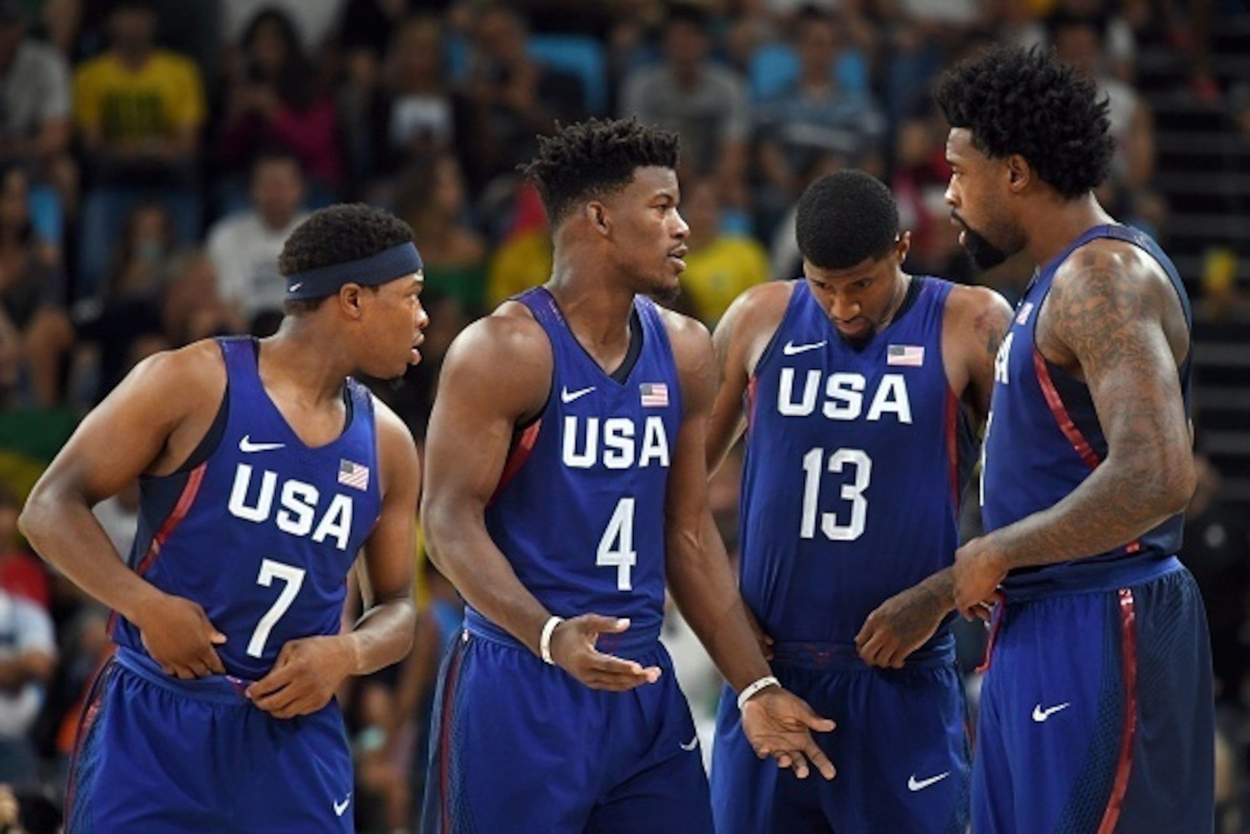 (From L) USA's guard Kyle Lowry, USA's forward Jimmy Butler, USA's guard Paul George and USA's centre DeAndre Jordan talk during a Men's round Group A basketball match between China and USA at the Carioca Arena 1 in Rio de Janeiro on August 6, 2016 during