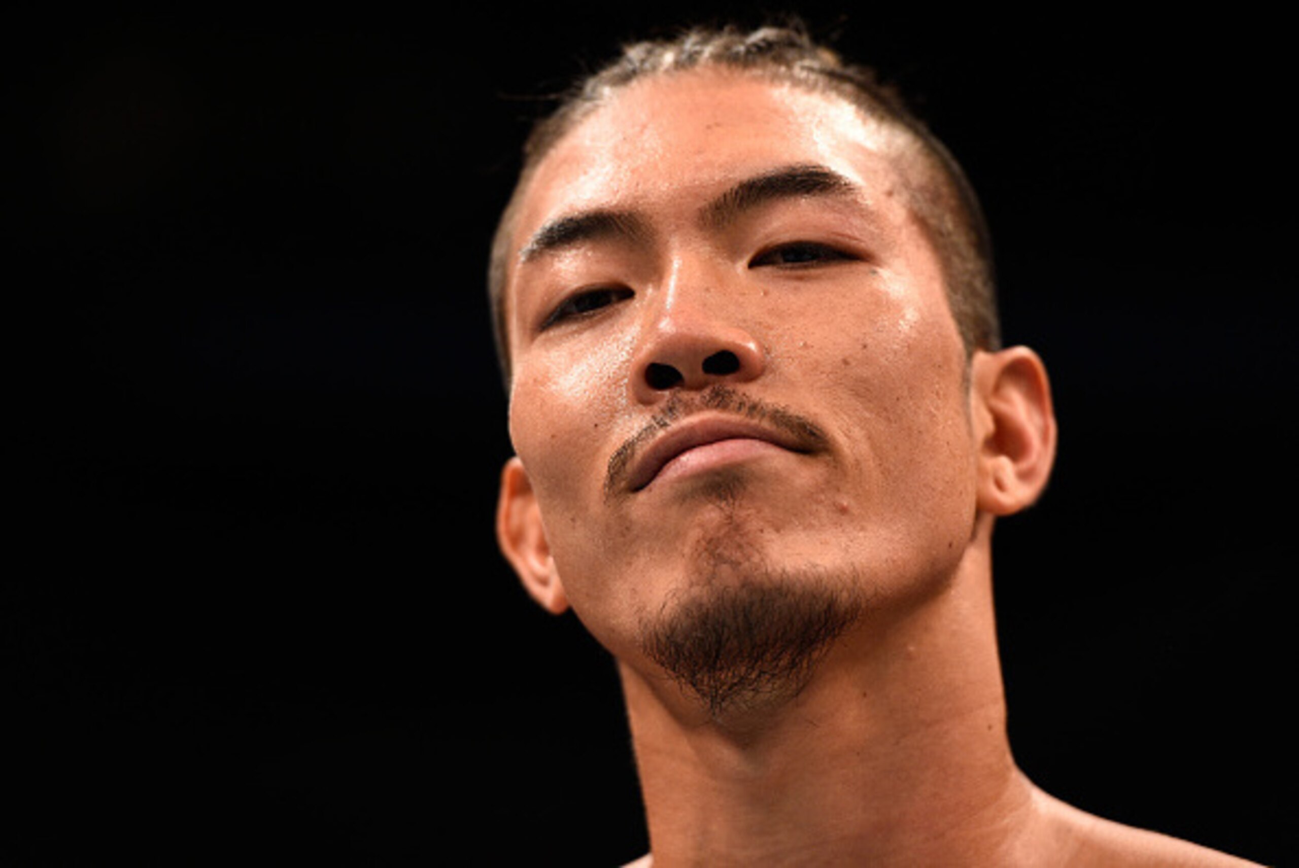 SALT LAKE CITY, UT - AUGUST 06: Teruto Ishihara of Japan celebrates his victory over Horacio Gutierrez of Mexico in their featherweight bout during the UFC Fight Night event at Vivint Smart Home Arena on August 6, 2016 in Salt Lake City, Utah. (Photo by SALT LAKE CITY, UT - AUGUST 06: Teruto Ishihara of Japan celebrates his victory over Horacio Gutierrez of Mexico in their featherweight bout during the UFC Fight Night event at Vivint Smart Home Arena on August 6, 2016 in Salt Lake City, Utah. (Photo by