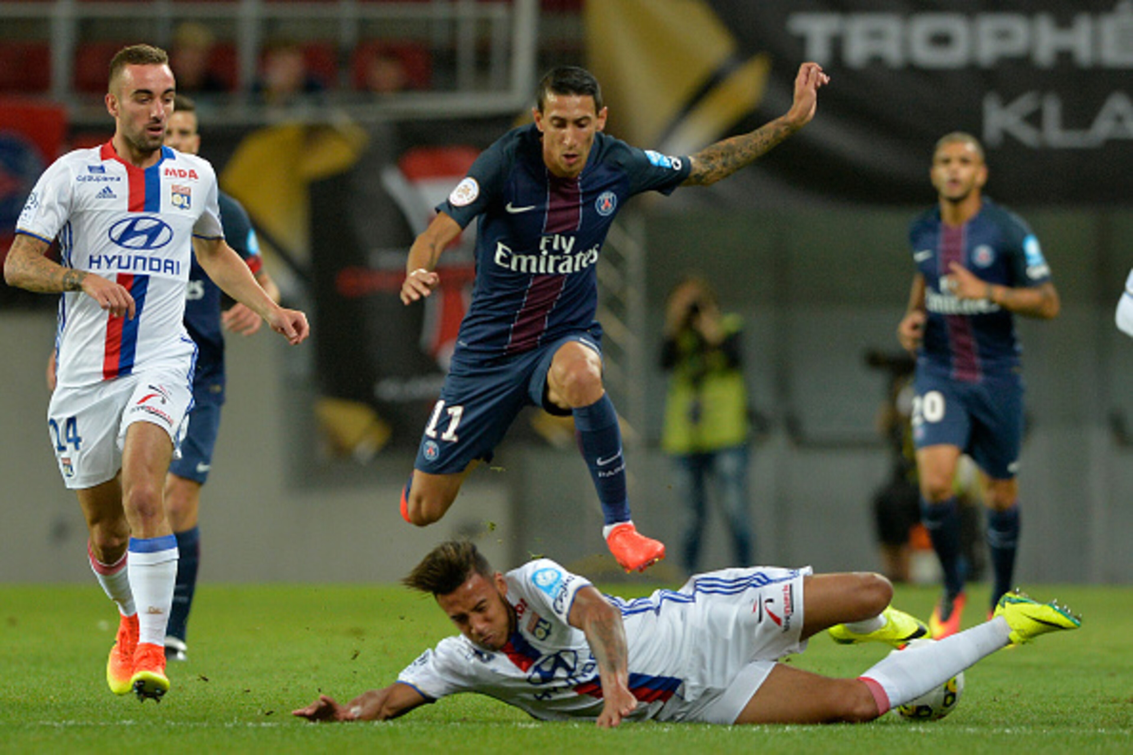 Paris Saint-Germain's Argentinian forward Angel Di Maria (C) is tackled by Lyon's French midfielder Nabil Fekir during the French Trophy of Champions football match between Olympique de Lyon and Paris Saint-Germain at Worthersee Stadion in Klagenfurt, on Paris Saint-Germain's Argentinian forward Angel Di Maria (C) is tackled by Lyon's French midfielder Nabil Fekir during the French Trophy of Champions football match between Olympique de Lyon and Paris Saint-Germain at Worthersee Stadion in Klagenfurt, on