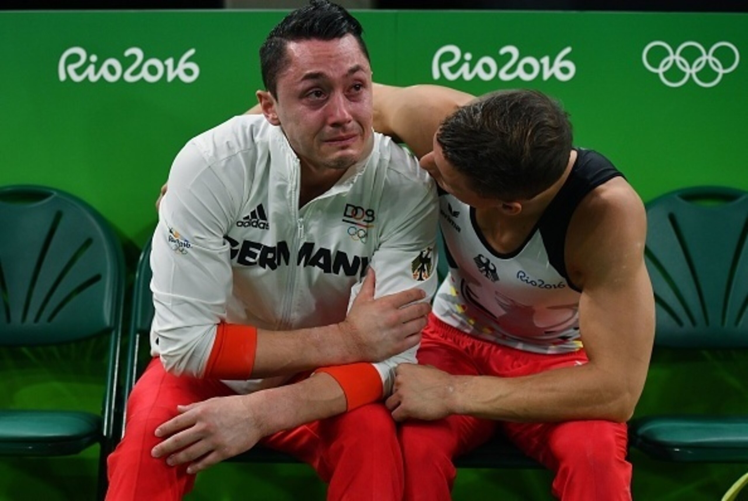 Germany's Andreas Toba (L) reacts during the qualifying for the men's Artistic Gymnastics at the Olympic Arena during the Rio 2016 Olympic Games in Rio de Janeiro on August 6, 2016.
Toba has been ruled out after suffering a cruciate ligament injury to his