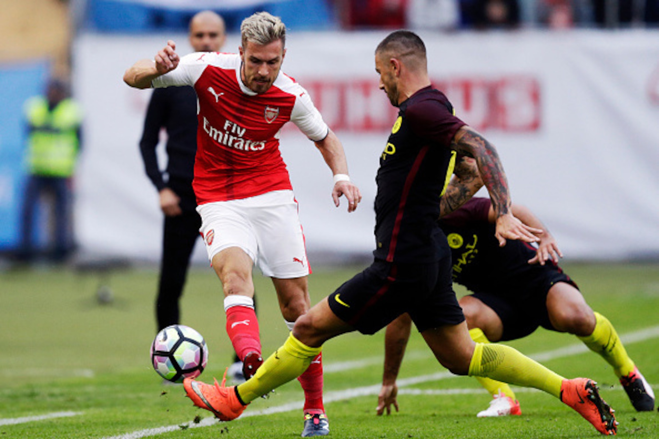 GOTHENBURG, SWEDEN - AUGUST 07: Aaron Ramsey of Arsenal and Aleksandar Kolarov of Manchester City competes for the ball during the Pre-Season Friendly between Arsenal and Manchester City at Ullevi on August 7, 2016 in Gothenburg, Sweden. (Photo by Nils Pe