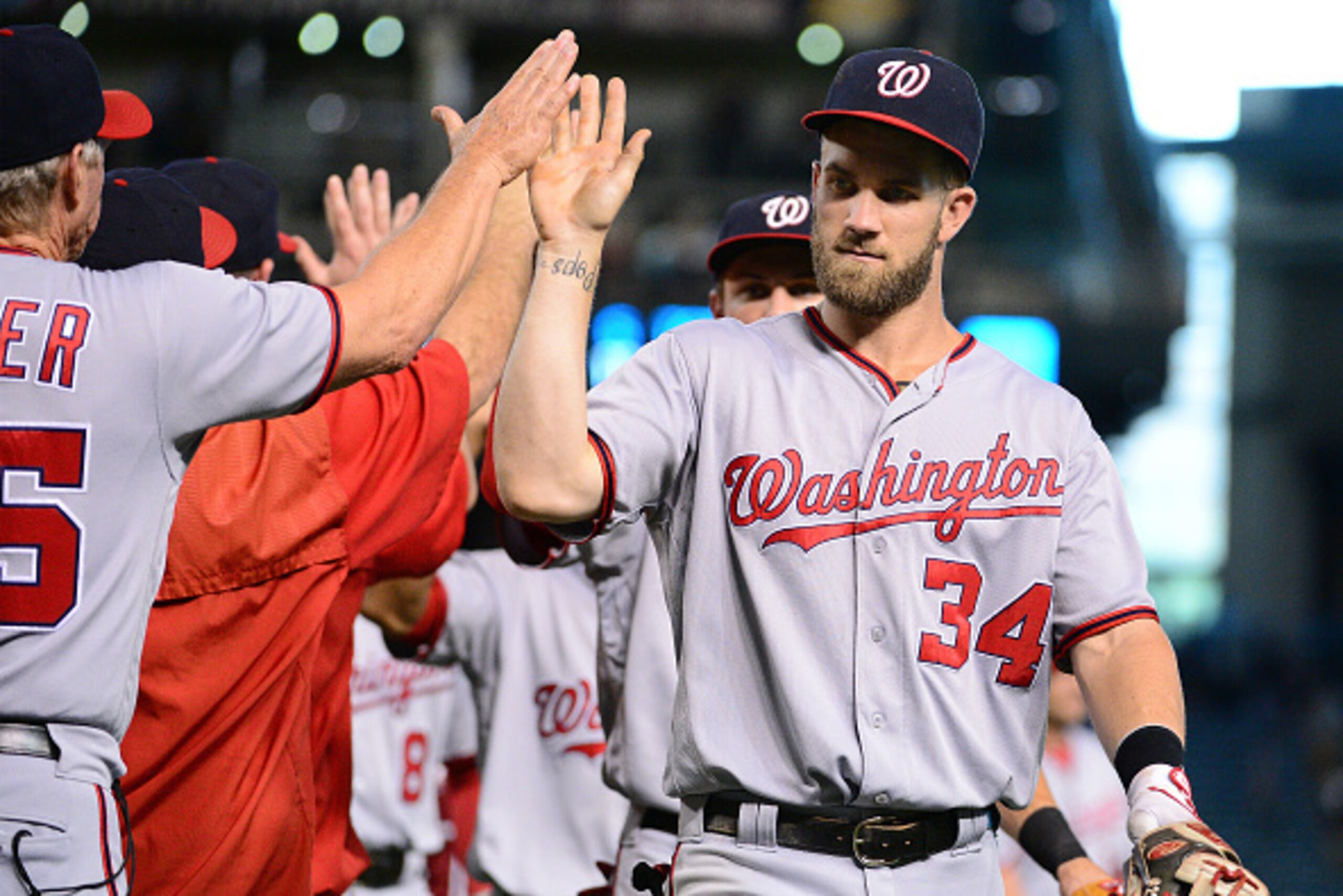 PHOENIX, AZ - AUGUST 03:  Bryce Harper #34 of the Washington Nationals is congratulated after beating the Arizona Diamondbacks at Chase Field on August 3, 2016 in Phoenix, Arizona.  The Washington Nationals won 8-3. (Photo by Jennifer Stewart/Getty Images