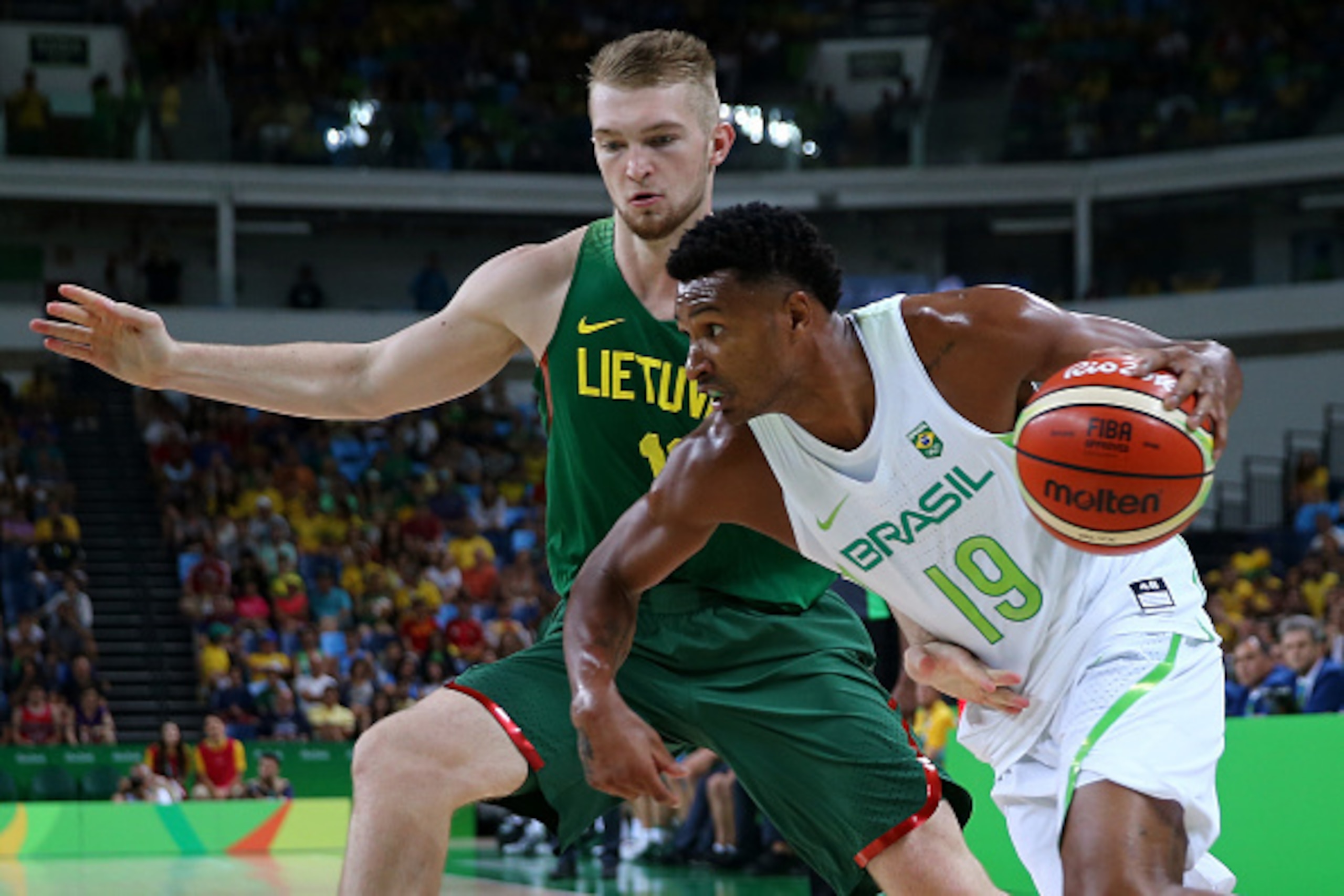 RIO DE JANEIRO, BRAZIL - AUGUST 07:  Leandro Barbosa of Brazil drives the ball against Renaldas Seibutis of Lithuania during a Men's preliminary round basketball game between Brazil and Lithuania on Day 2 of the Rio 2016 Olympic Games at Carioca Arena 1 o