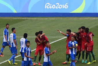 Tobias Figueiredo (2nd R) of Portugal celebrates with teammates after scoring against Honduras during their Rio 2016 Olympic Games men's First Round Group D football match at the Olympic Stadium in Rio de Janeiro, Brazil, on August 7, 2016. / AFP / VANDER